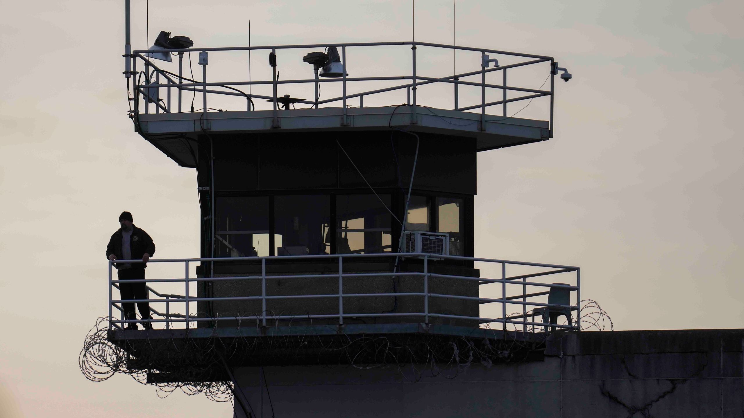 FILE - A guard stands in a tower at Indiana State Prison on Tuesday, Dec. 17, 2024, in Michigan City, Ind. (AP Photo/Erin Hooley, File)