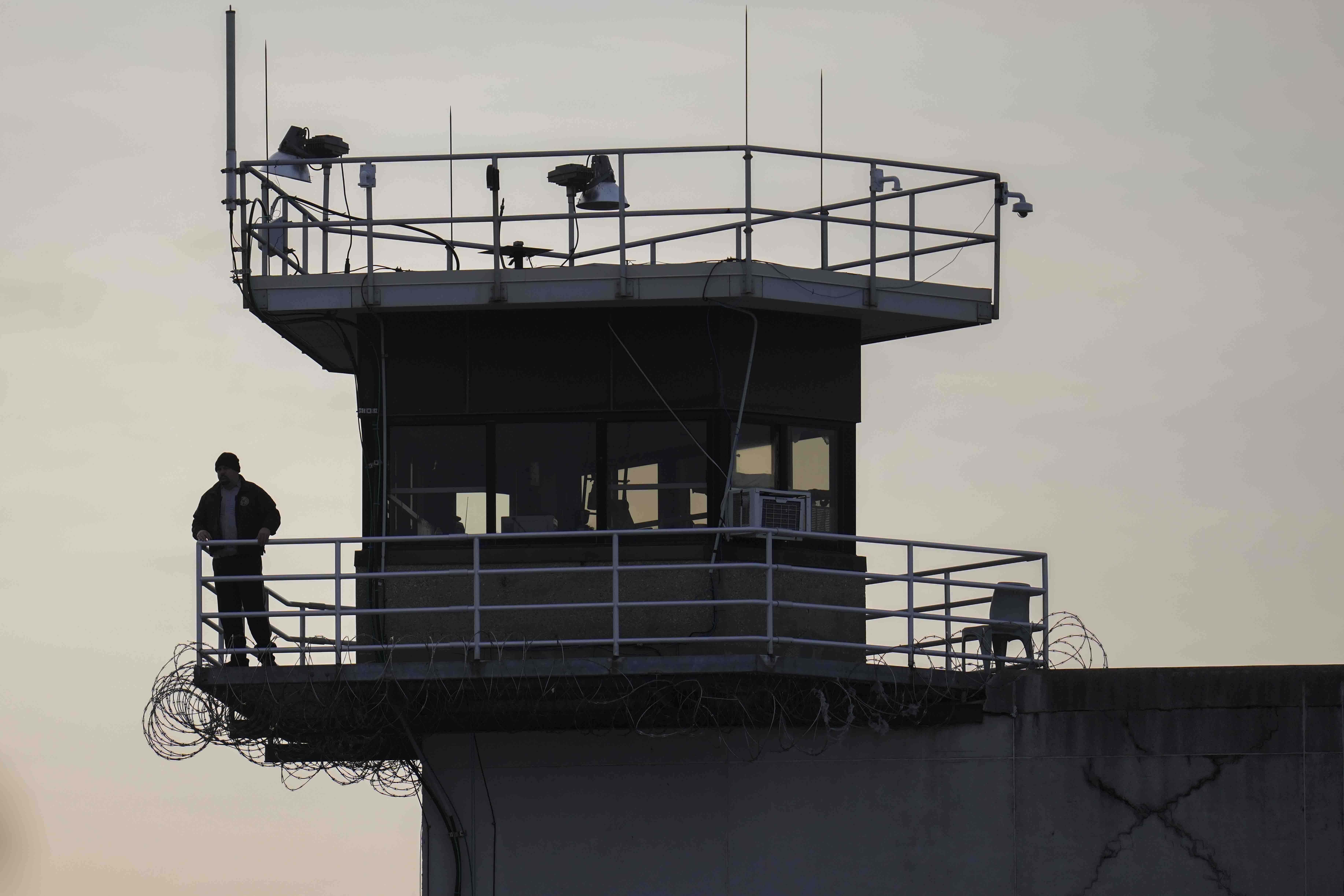 FILE - A guard stands in a tower at Indiana State Prison on Tuesday, Dec. 17, 2024, in Michigan City, Ind. (AP Photo/Erin Hooley, File)