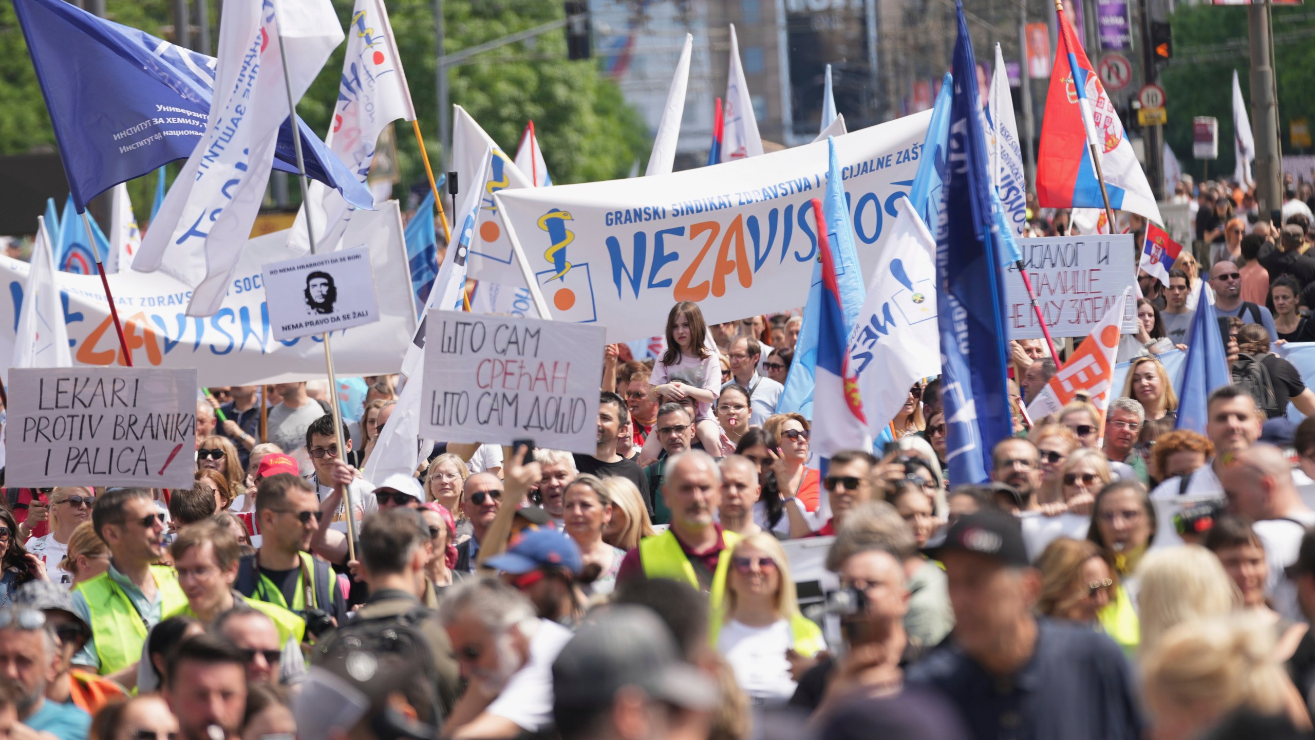 University students and people protest in front of the government building, six months after the deadly train station tragedy that sparked mass demonstrations against corruption, in Belgrade, Serbia, Thursday, May 1, 2025. (AP Photo/Darko Vojinovic)