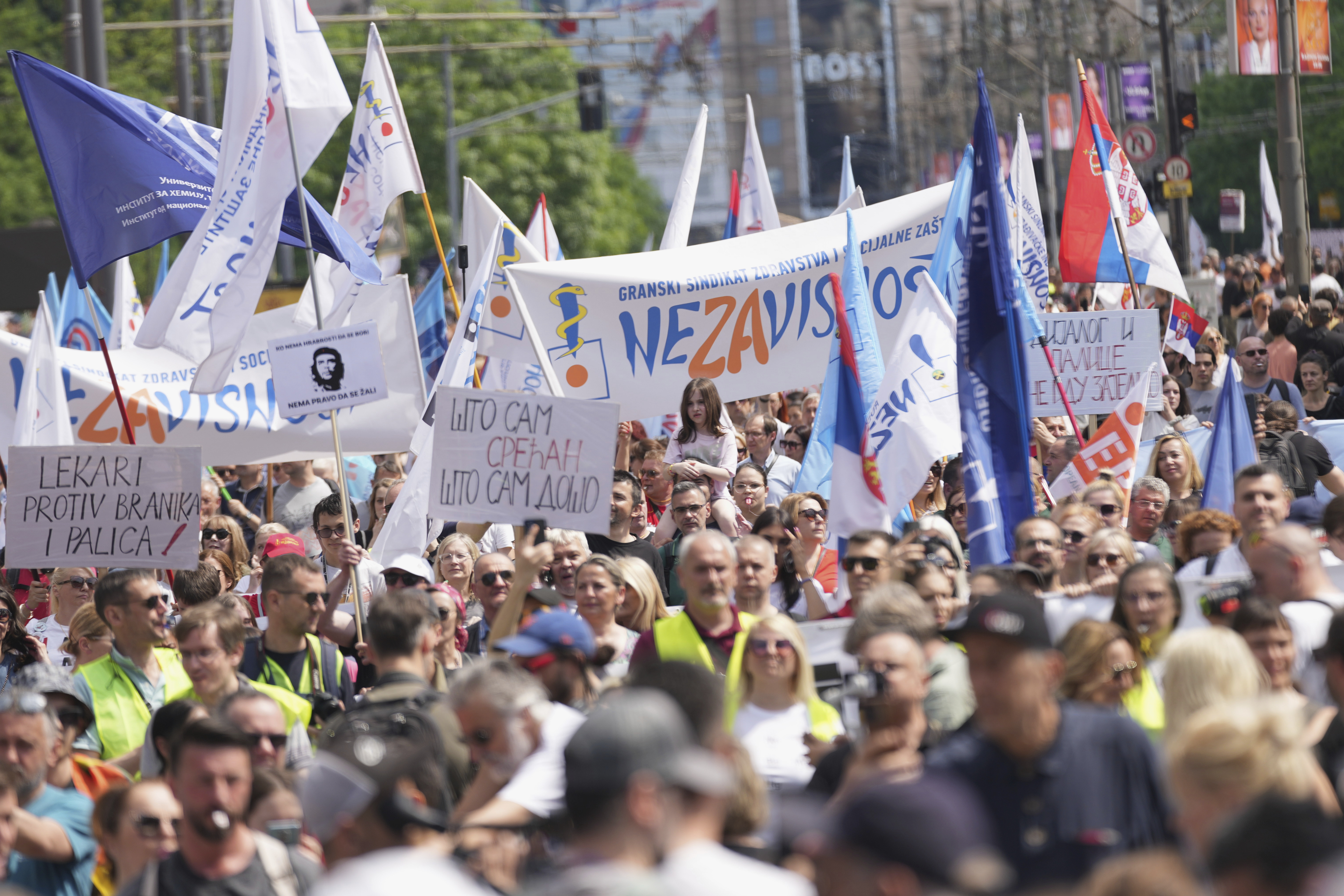 University students and people protest in front of the government building, six months after the deadly train station tragedy that sparked mass demonstrations against corruption, in Belgrade, Serbia, Thursday, May 1, 2025. (AP Photo/Darko Vojinovic)