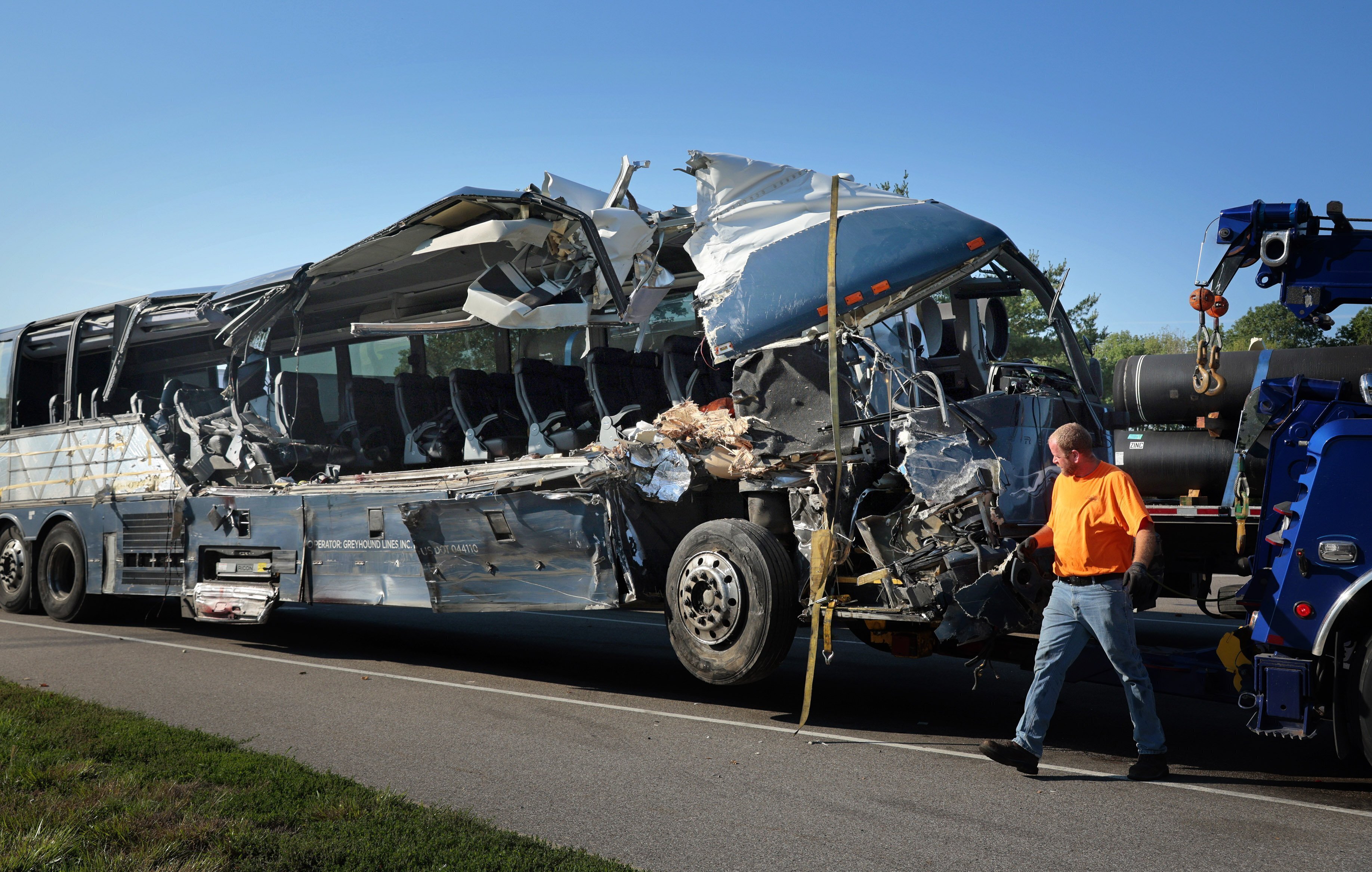 FILE - A damaged Greyhound bus is prepared for transport on Wednesday, July 12, 2023, from the scene of a fatal wreck on westbound Interstate 70 after the bus collided with a tractor-trailer near Highland, Ill. (Christian Gooden/St. Louis Post-Dispatch via AP,File)