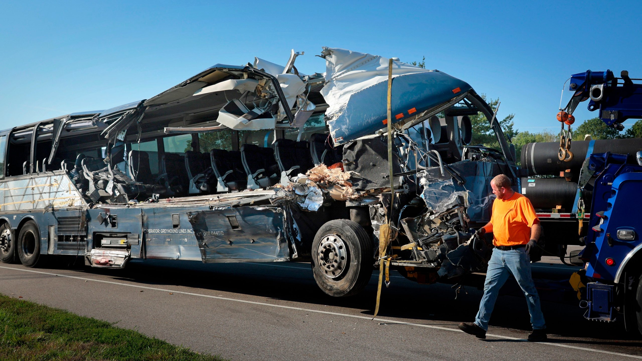 FILE - A damaged Greyhound bus is prepared for transport on Wednesday, July 12, 2023, from the scene of a fatal wreck on westbound Interstate 70 after the bus collided with a tractor-trailer near Highland, Ill. (Christian Gooden/St. Louis Post-Dispatch via AP,File)