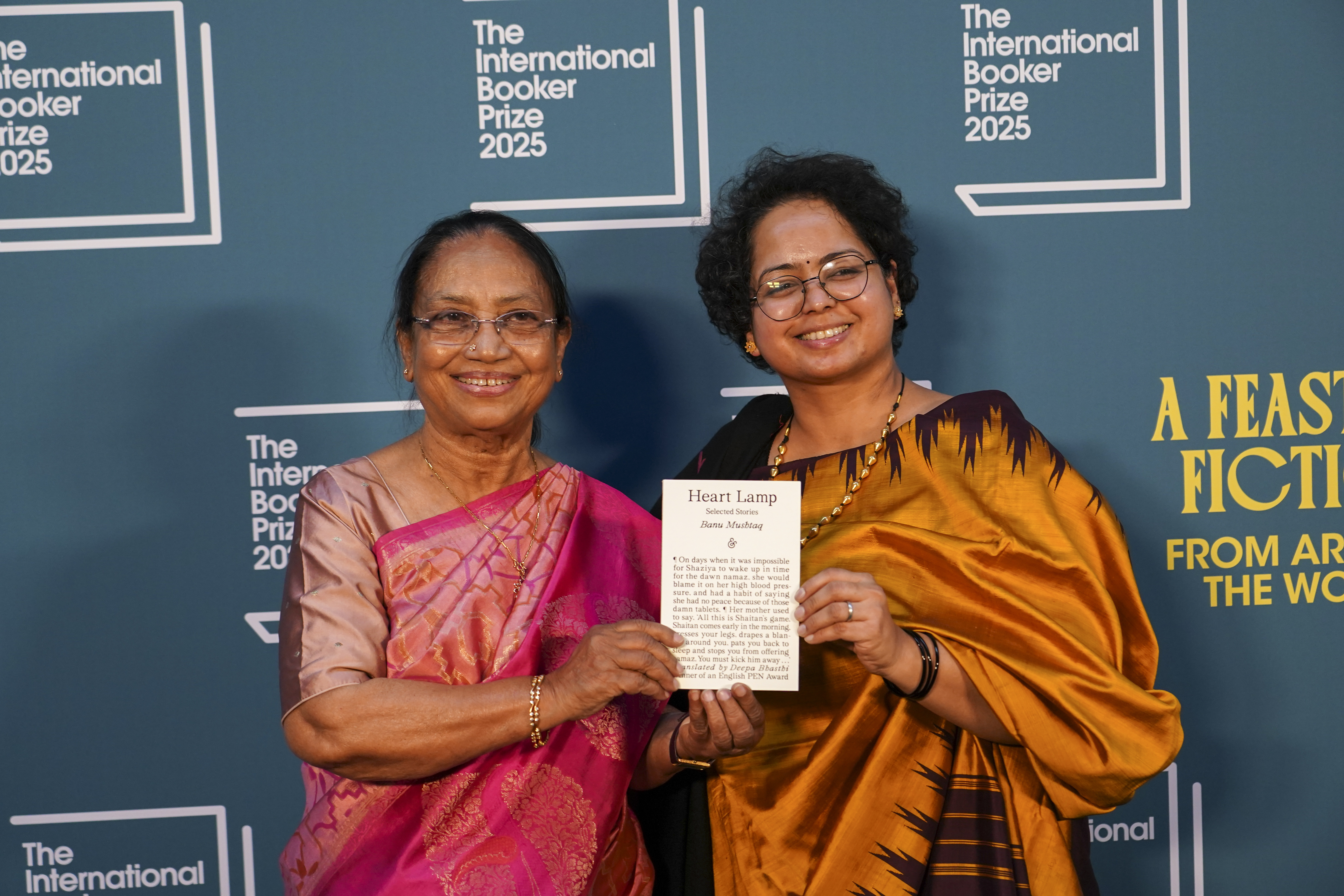 Banu Mushtaq, author of 'Heart Lamp' left, and Deepa Bhasthi pose for photographers upon arrival for the International Booker Prize, in London, Tuesday, May 20, 2025.(AP Photo/Alberto Pezzali)