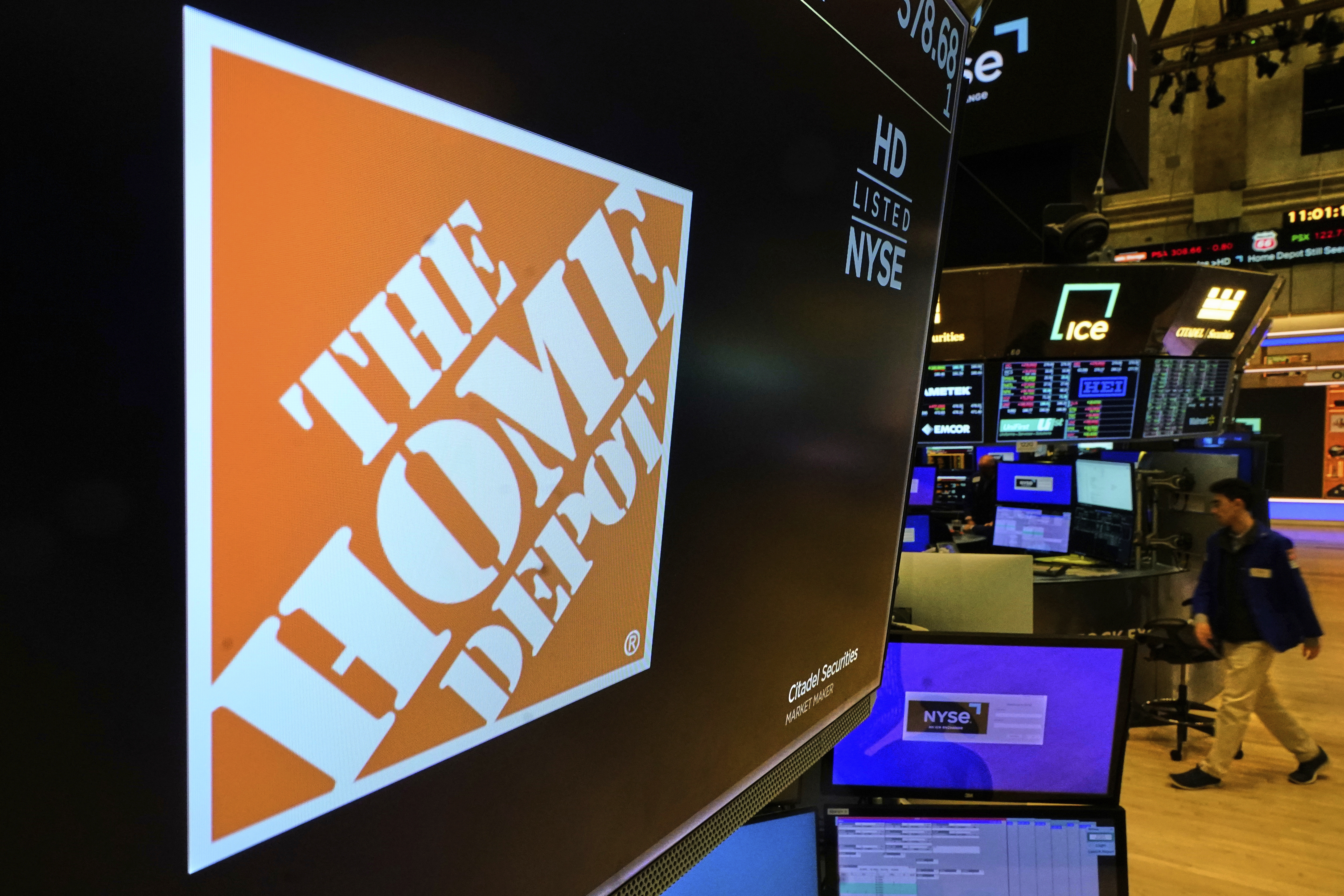 The logo for Home Depot is displayed above a trading post on the floor of the New York Stock Exchange, Tuesday, May 20, 2025. (AP Photo/Richard Drew)