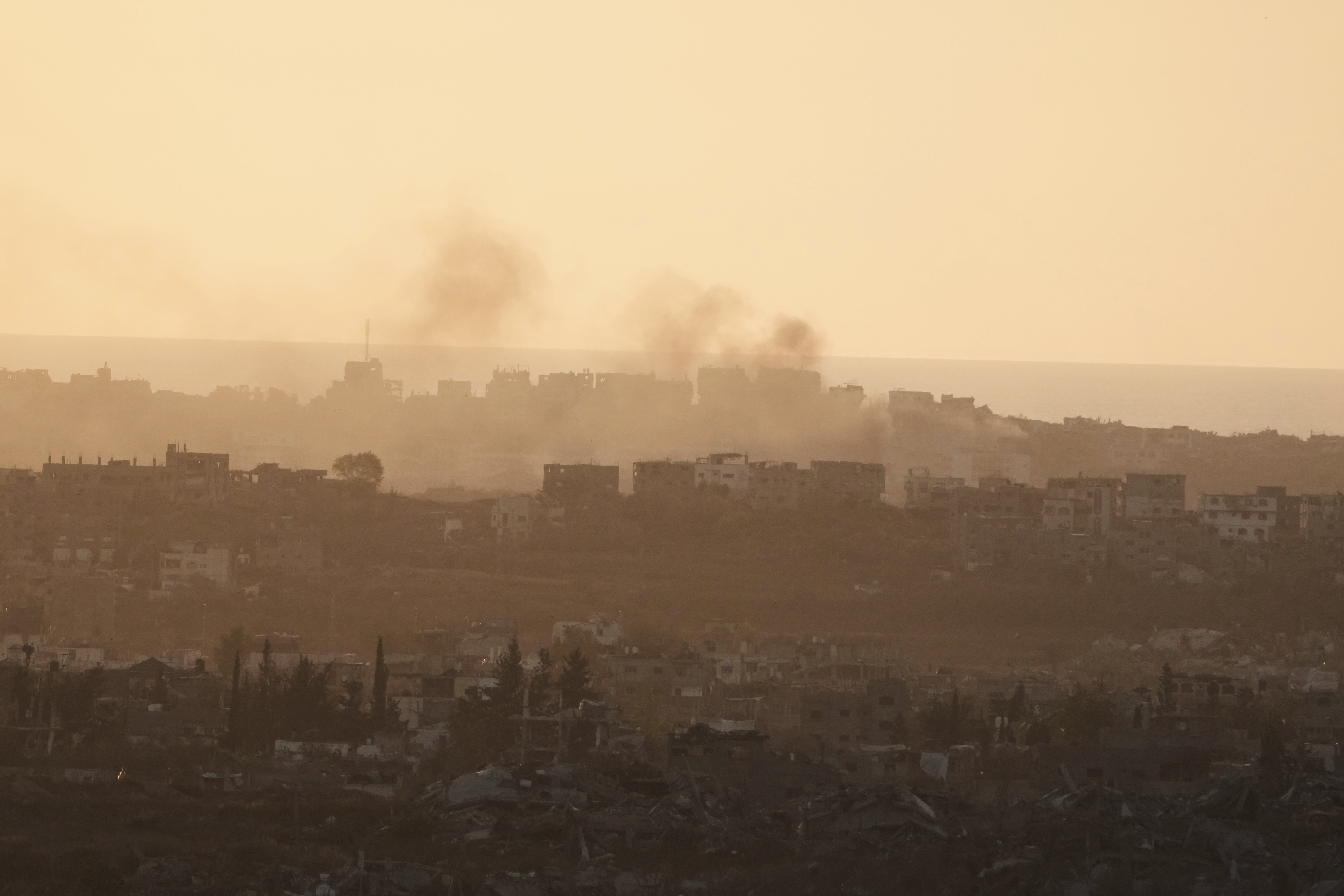 Smoke rises following an Israeli army bombardment in Gaza Strip, seen from southern Israel, Tuesday, May 20, 2025. (AP Photo/Maya Alleruzzo)