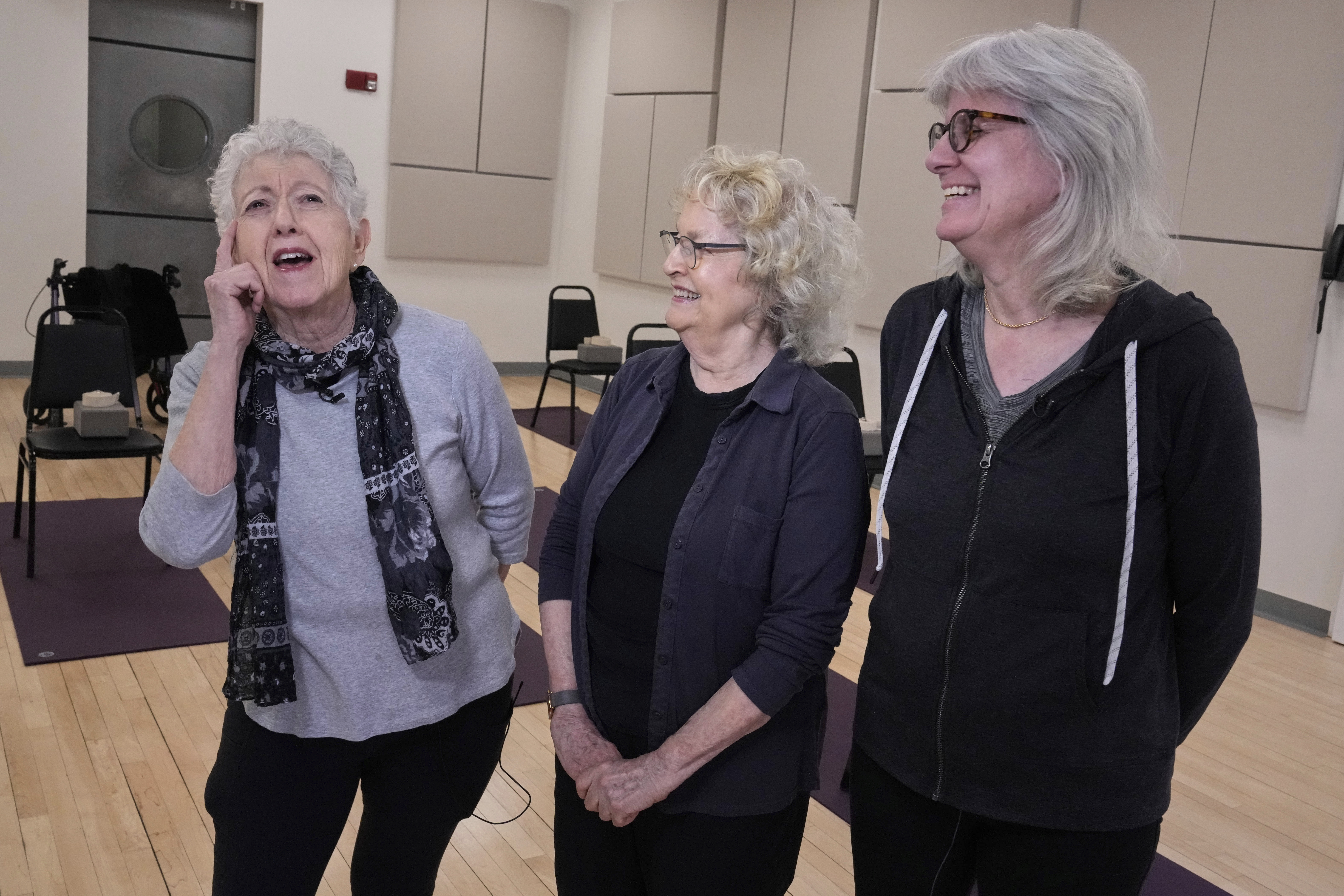 Marian Rodman, from left, Harriet Luria, and Carol Leister speak about their chair yoga class at the Marlene Meyerson JCC Manhattan, in New York, March 28, 2025. (AP Photo/Richard Drew)