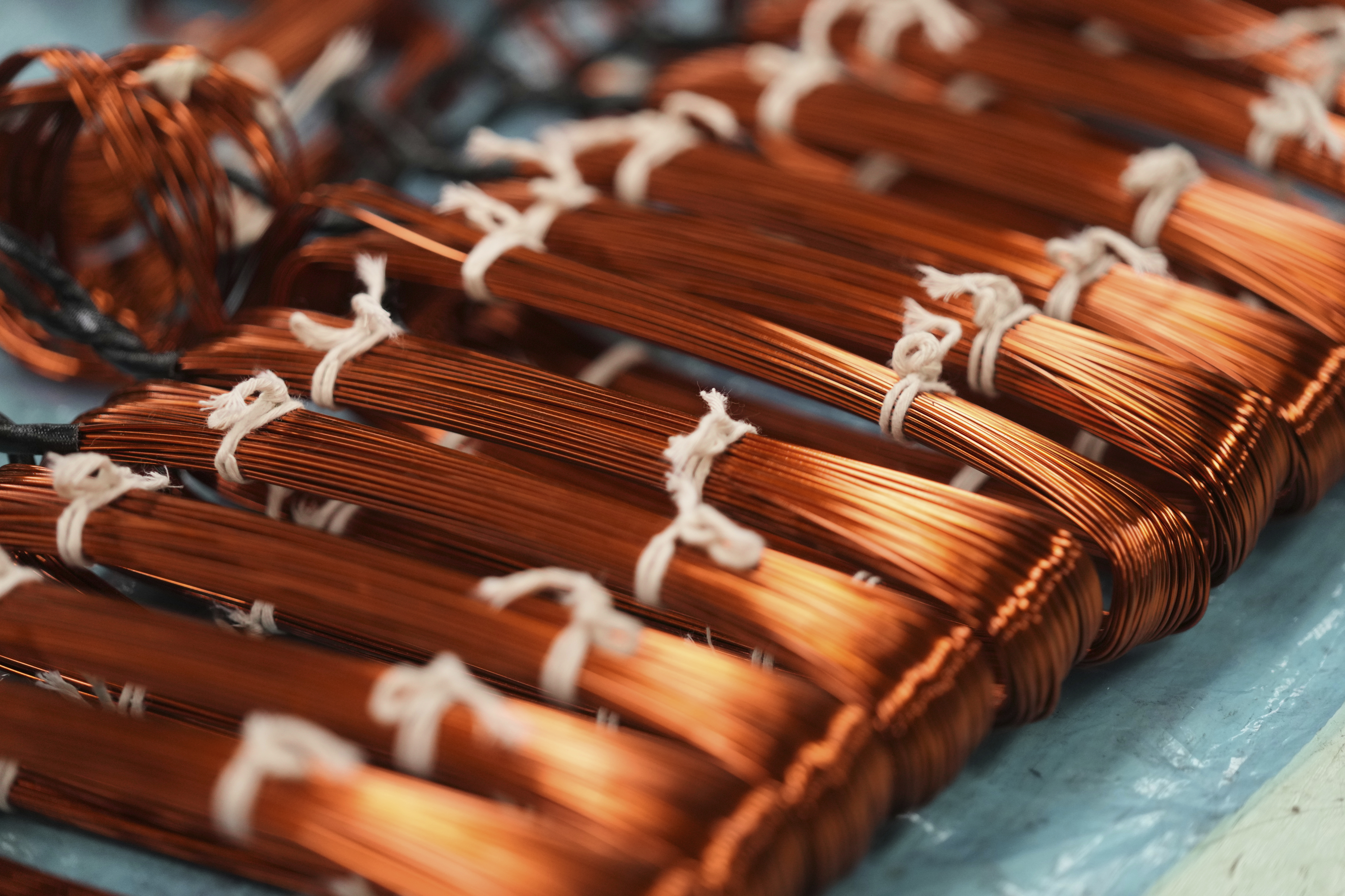 FILE - Bundles of copper cables sit at a plant that produces parts for large electric vehicles in Mexico City, on April 2, 2025. (AP Photo/Fernando Llano, File)