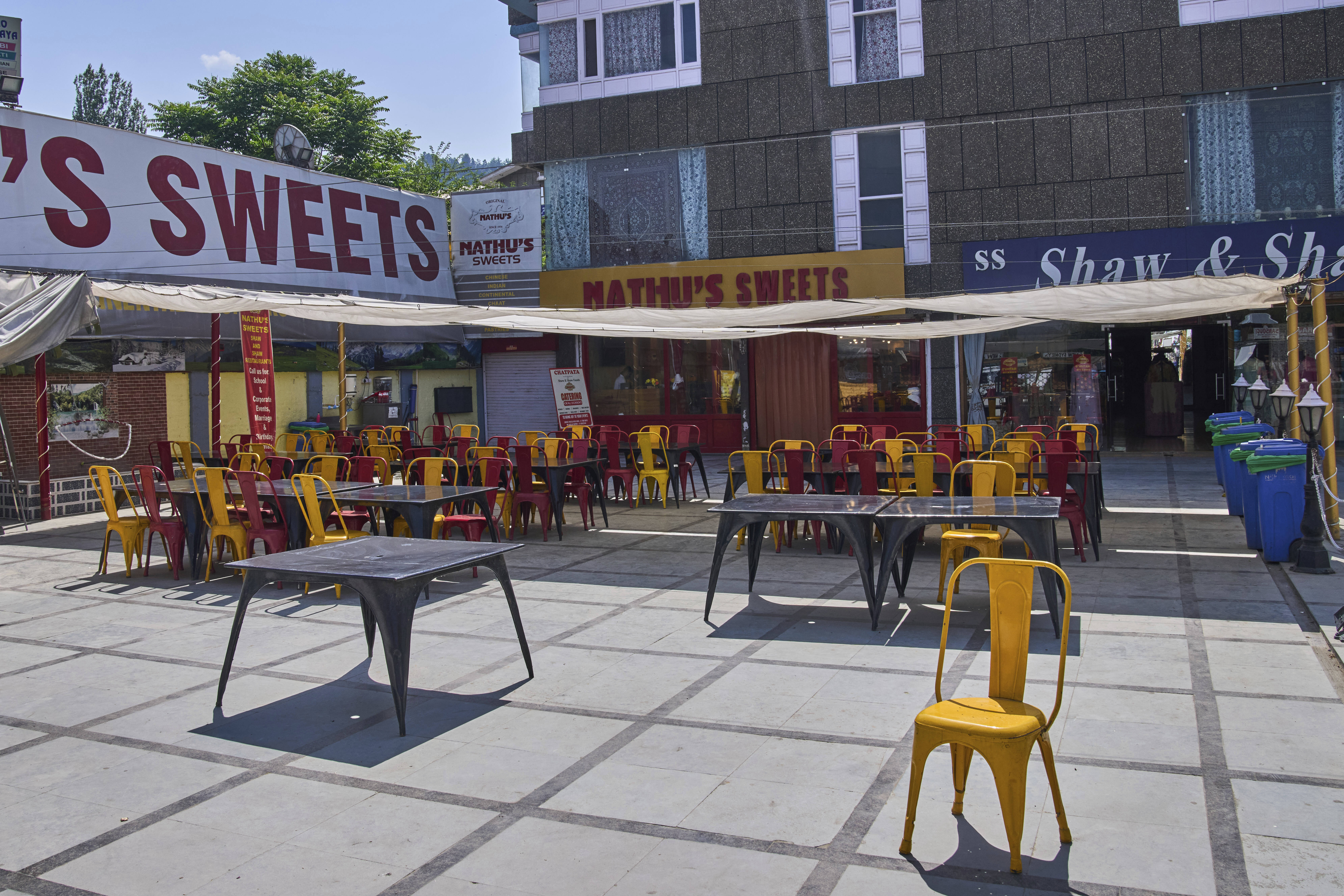 Tables and chairs outside a restaurant wearing a deserted look near Dal Lake in Srinagar, Indian controlled Kashmir, India, Tuesday, May 20, 2025. (AP Photo/Dar Yasin)