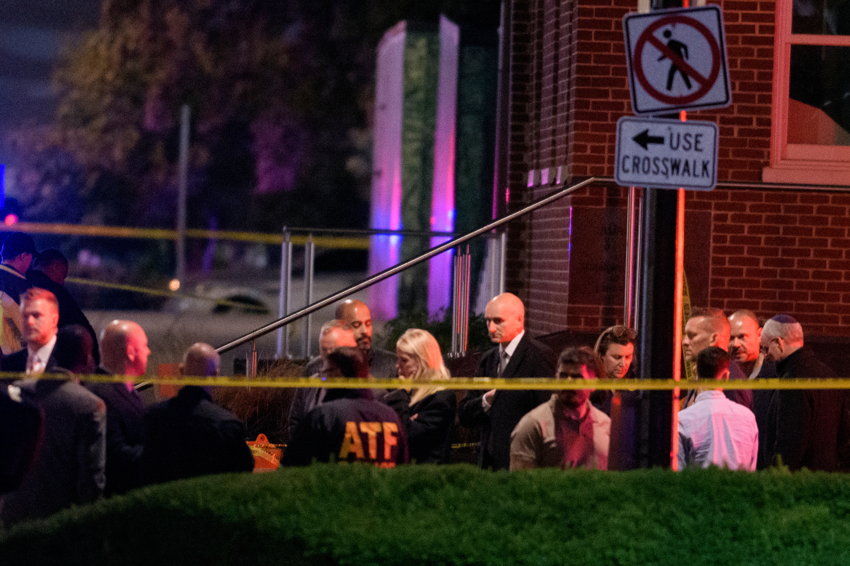 Attorney General Pam Bondi, center, walks to her car as law enforcement work the scene after two staff members of the Israeli Embassy in Washington were shot and killed outside the Capital Jewish Museum, Thursday, May 22, 2025, in Washington. (AP Photo/Rod Lamkey, Jr.)