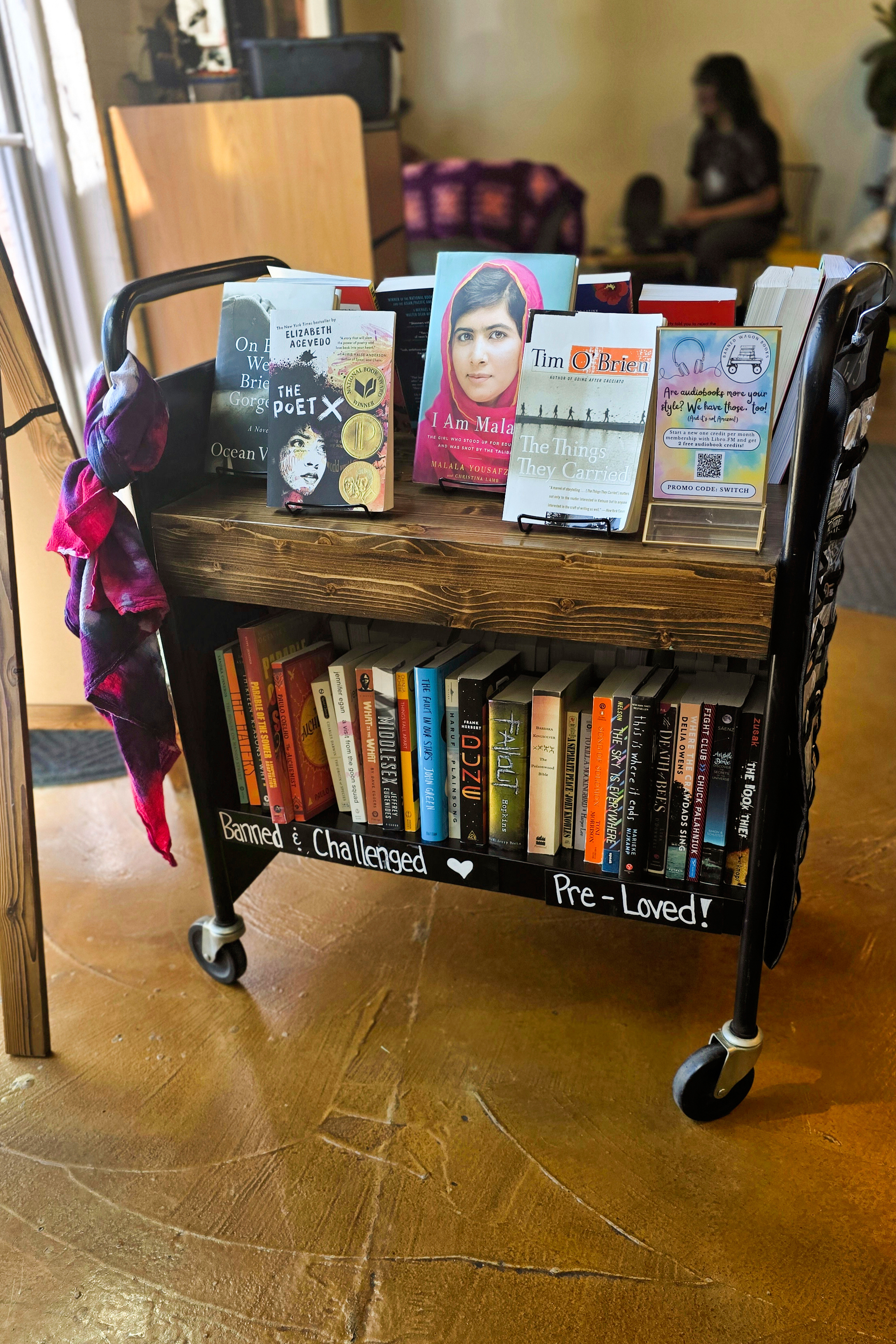 This photo provided by Amber Salazar shows the pop-up bookshop Banned Wagon Books at Dynamo Coffee Roasting Co., March 30, 2025, in Colorado Springs, Colo. (Amber Salazar via AP)
