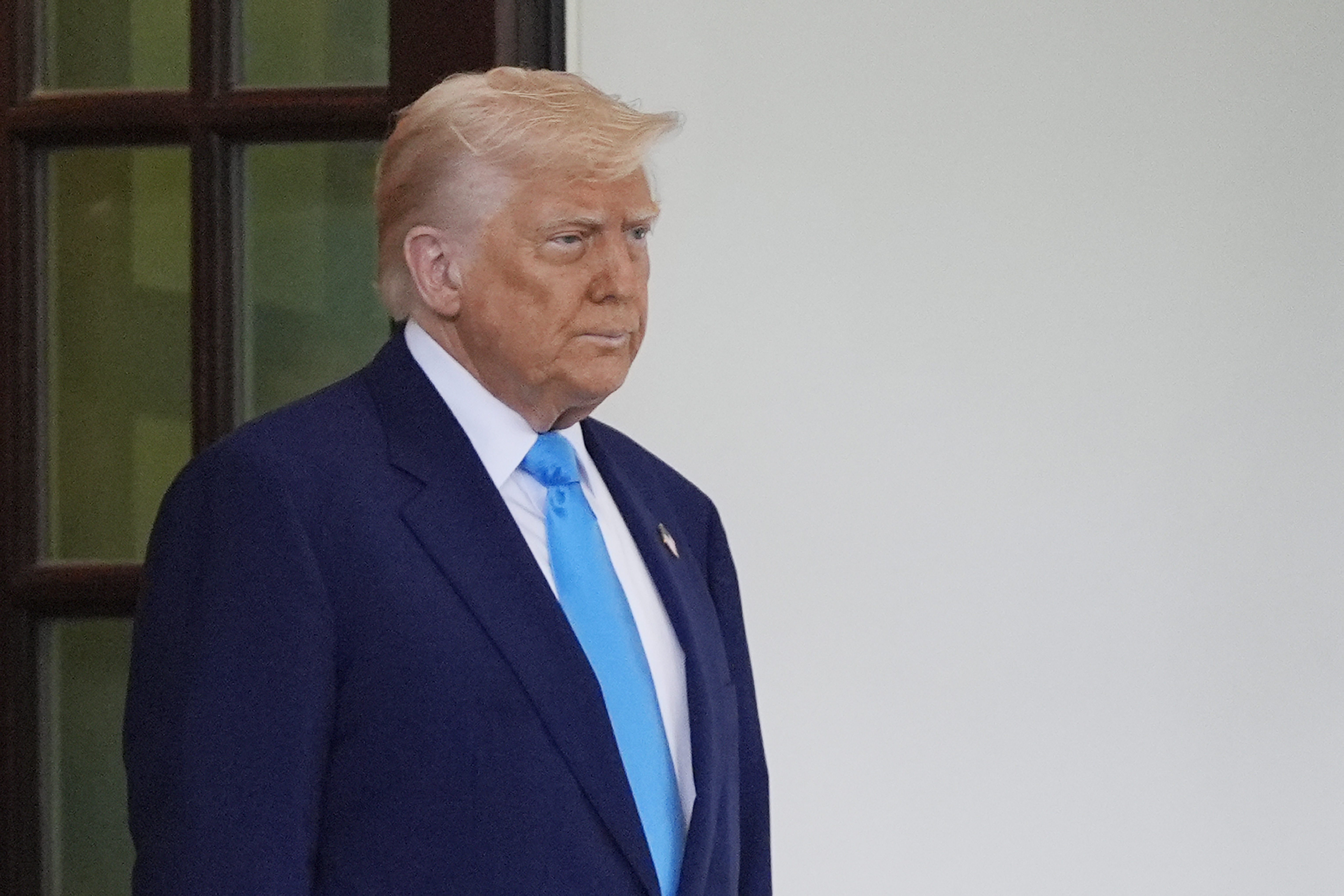 President Donald Trump waits to greet South African President Cyril Ramaphosa at the White House, Wednesday, May 21, 2025, in Washington. (AP Photo/Julia Demaree Nikhinson)