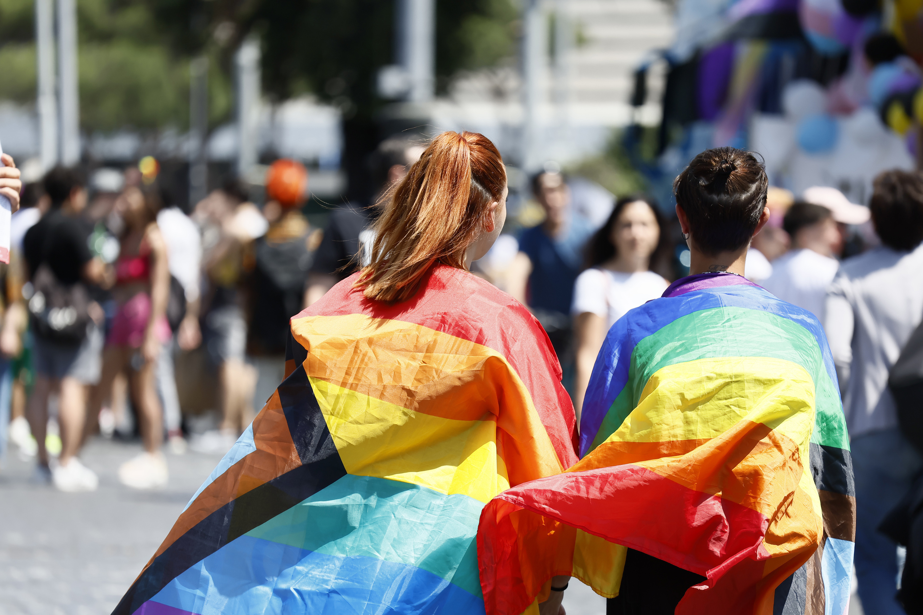 FILE - People wrapped in rainbow flags take part in the LGBTQ+ Pride parade in Rome, Saturday, June 10, 2023. (Cecilia Fabiano/LaPresse via AP, File)
