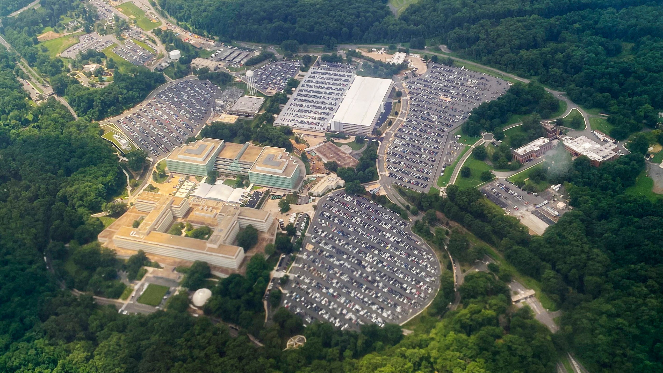 FILE - The Central Intelligence Agency (CIA) Headquarters, is seen from a commercial airliner as it files over the CIA campus in Langley, Va., July 24, 2023. (AP Photo/Pablo Martinez Monsivais, File)