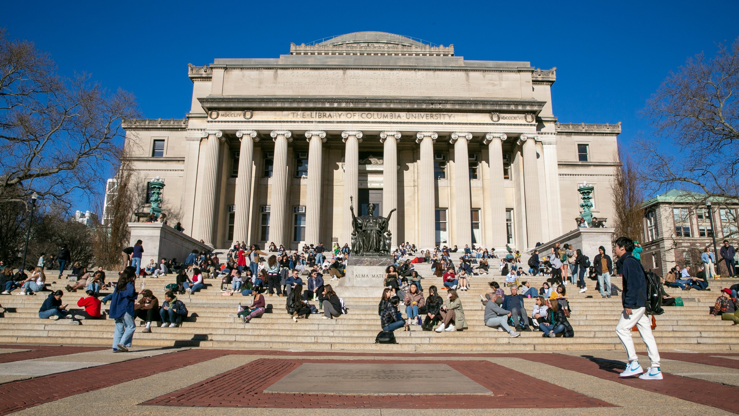 FILE - Students sit on the front steps of Low Memorial Library on the Columbia University campus in New York City, Feb. 10, 2023. (AP Photo/Ted Shaffrey, File)