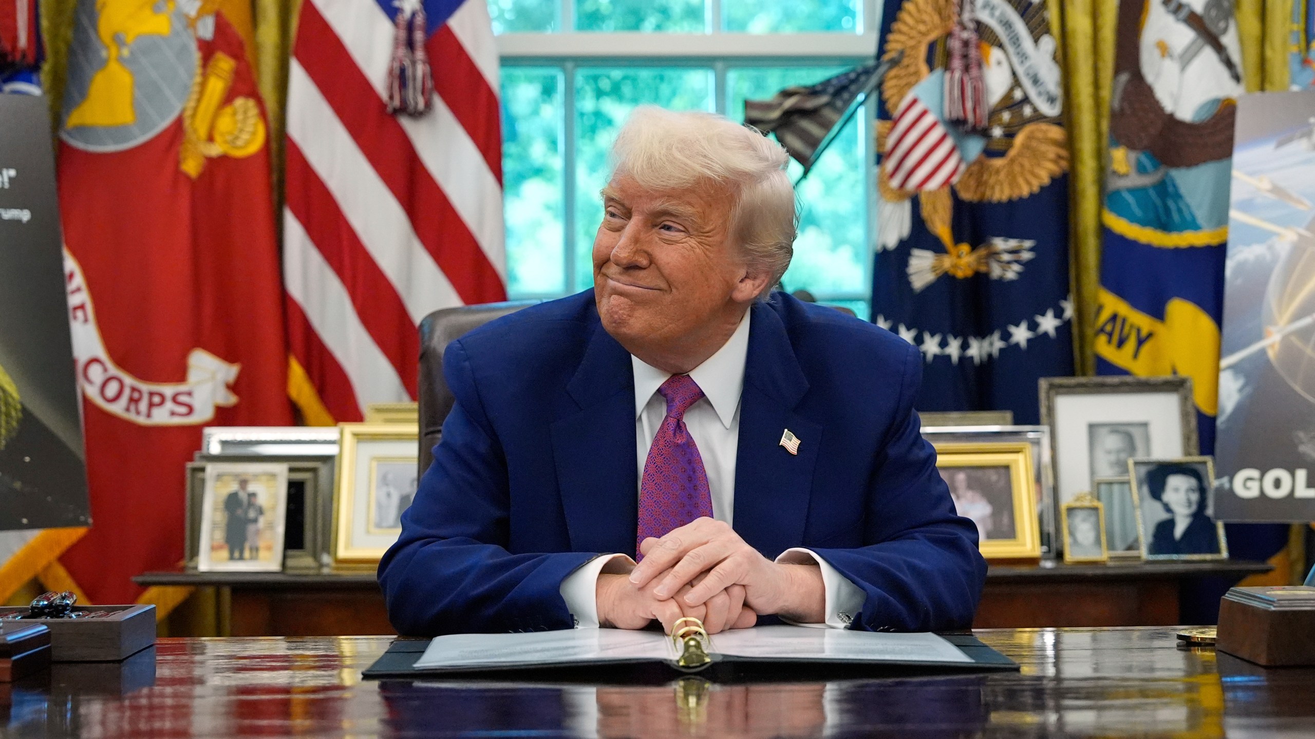 President Donald Trump smiles as he speaks in the Oval Office of the White House, Tuesday, May 20, 2025, in Washington. (AP Photo/Alex Brandon)