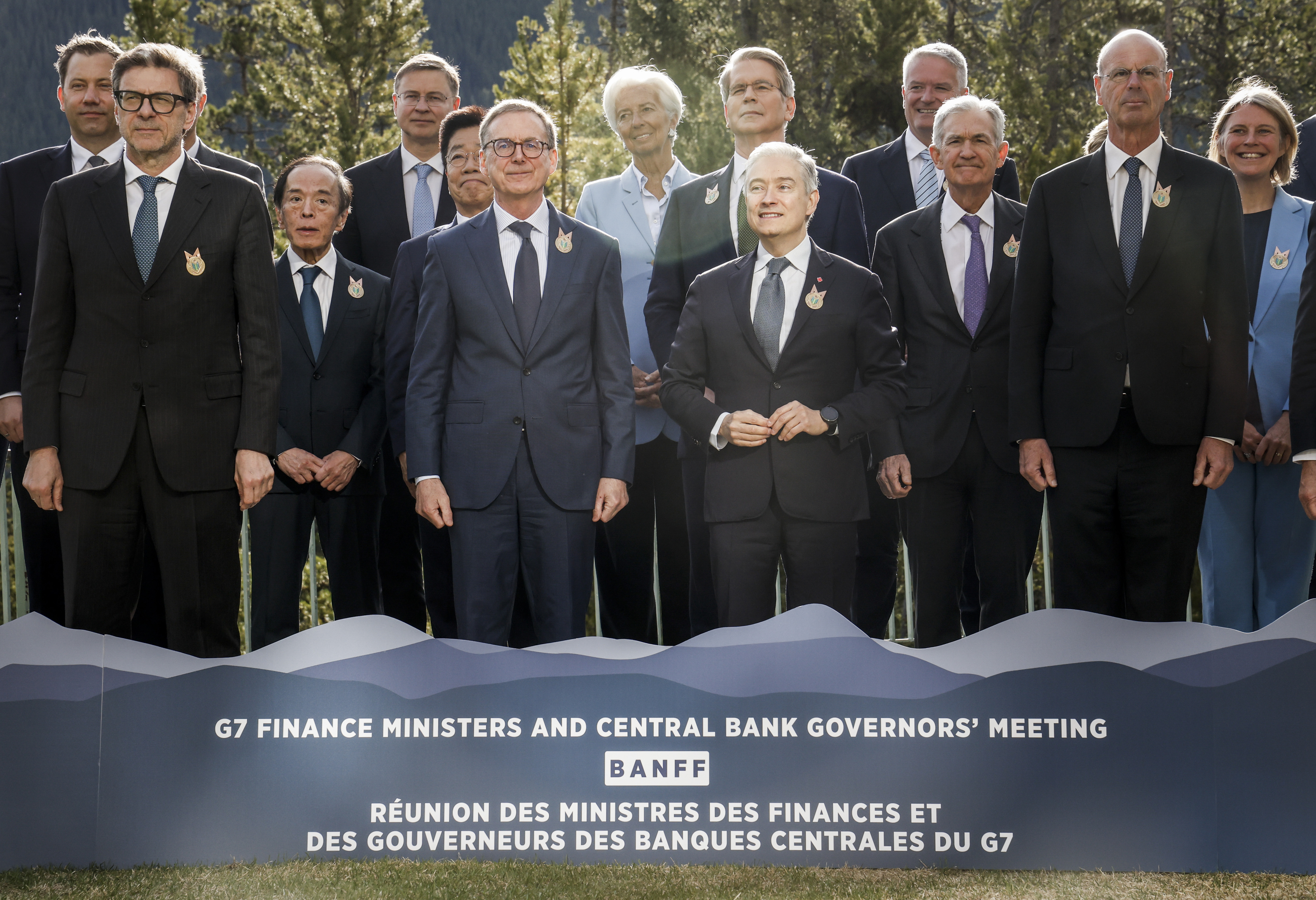Canada's Finance Minister Francois-Philippe Champagne, centre right, and Governor of the Bank of Canada Tiff Macklem, centre left, pose for a family photo with their colleagues at the G7 Finance Ministers meeting in Banff, Alta., Wednesday, May 21, 2025. (Jeff McIntosh /The Canadian Press via AP)
