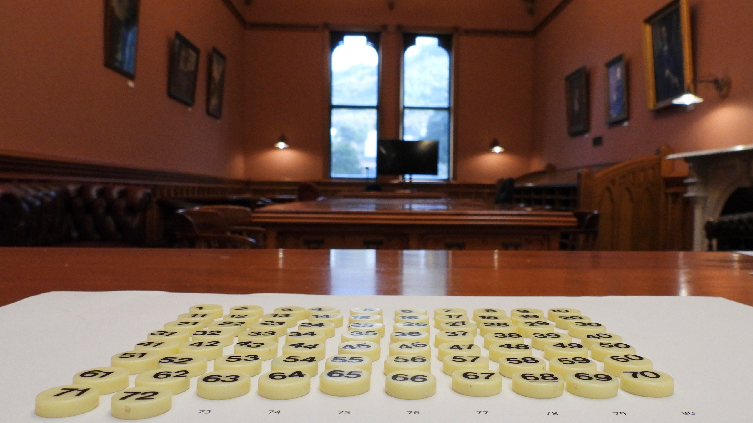 Bingo tokens, each representing a lawmaker's bill to be entered into the ballot, are laid out before the draw at Parliament in Wellington, New Zealand, Thursday, May 22, 2025. (AP Photo/Charlotte Graham-McLay)