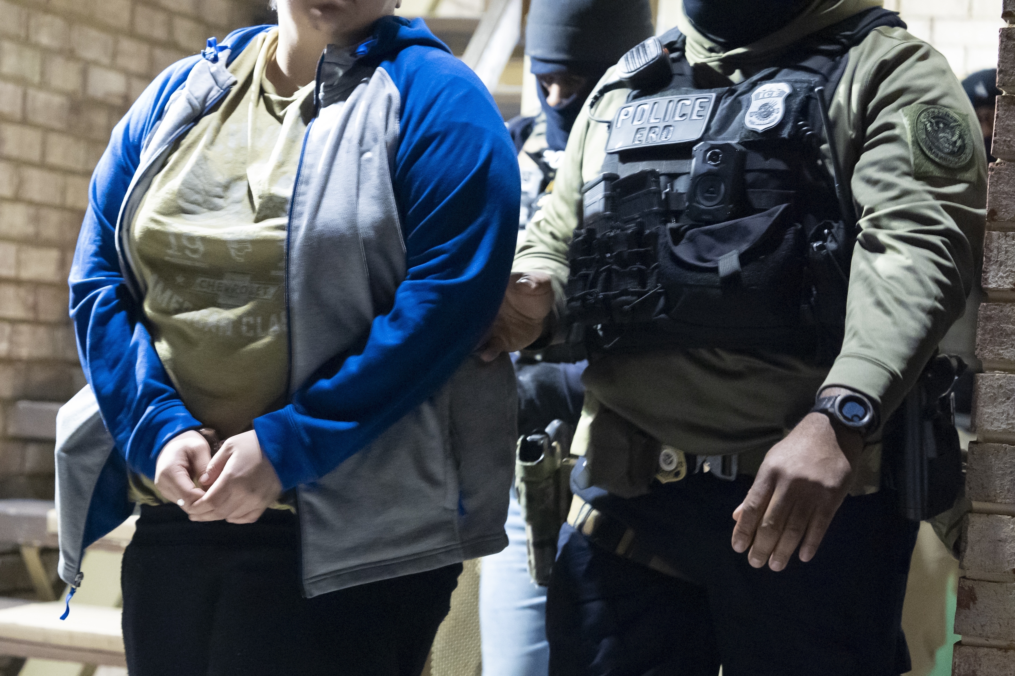 FILE - U.S. Immigration and Customs Enforcement officers detain a person, left, Monday, Jan. 27, 2025, in Silver Spring, Md. (AP Photo/Alex Brandon, File)