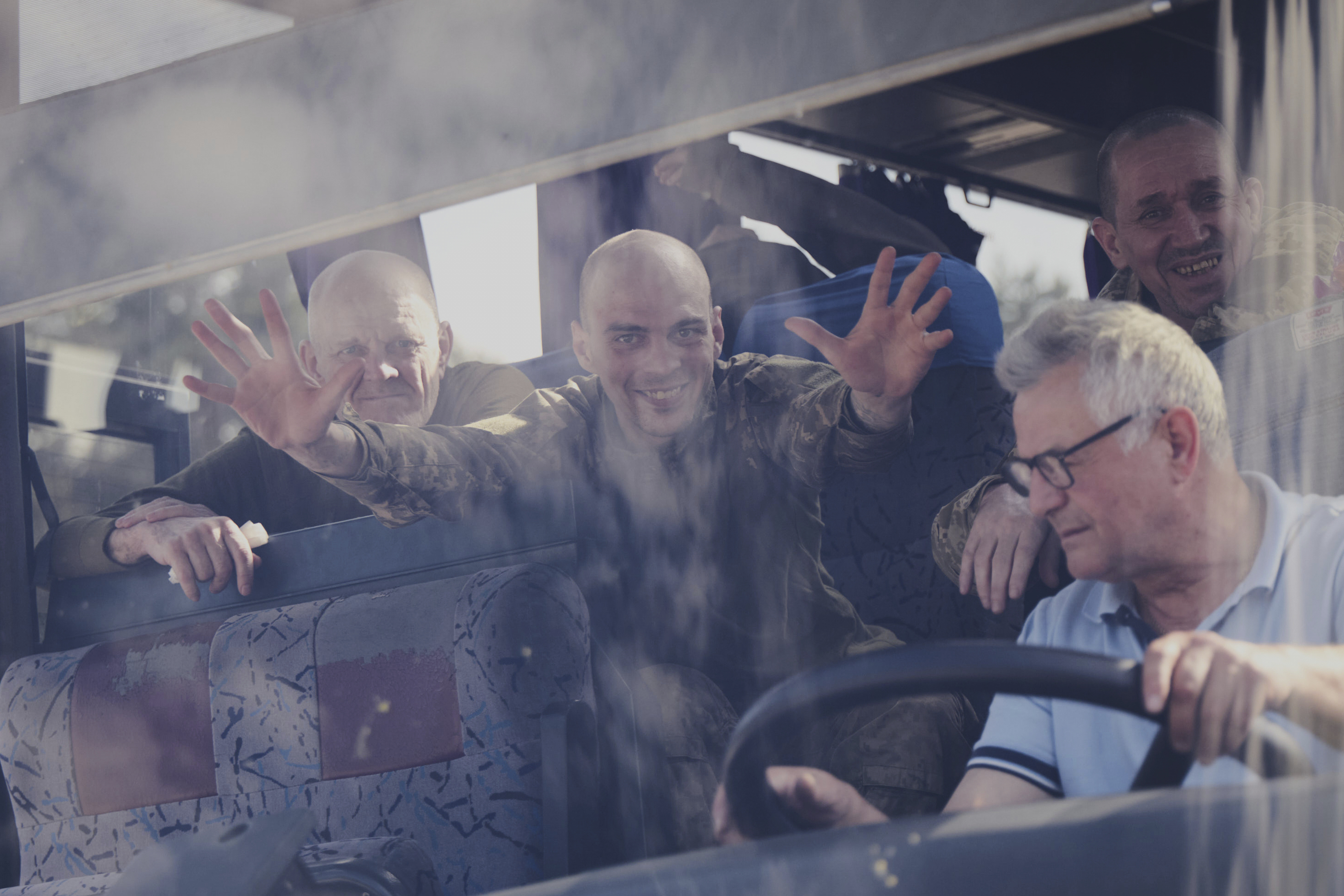 In this photo provided by the Ukrainian Presidential Press Office, Ukrainian servicemen ride in a bus after returning from captivity after an exchange between Russia and Ukraine, in Chernyhiv region, Ukraine, Friday, May 23, 2025. (Ukrainian Presidential Press Office via AP)
