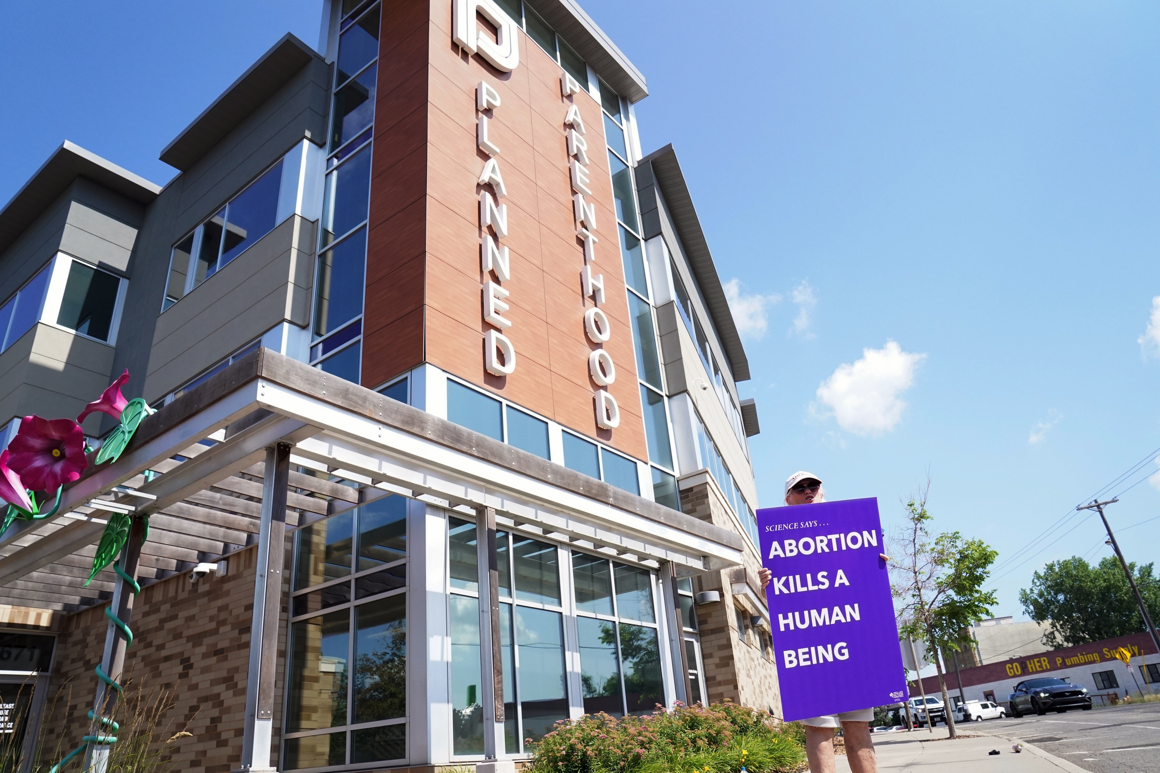 FILE - A protester demonstrates in front of a Planned Parenthood on July 12, 2022, in Saint Paul, Minn. (AP Photo/Abbie Parr, File)