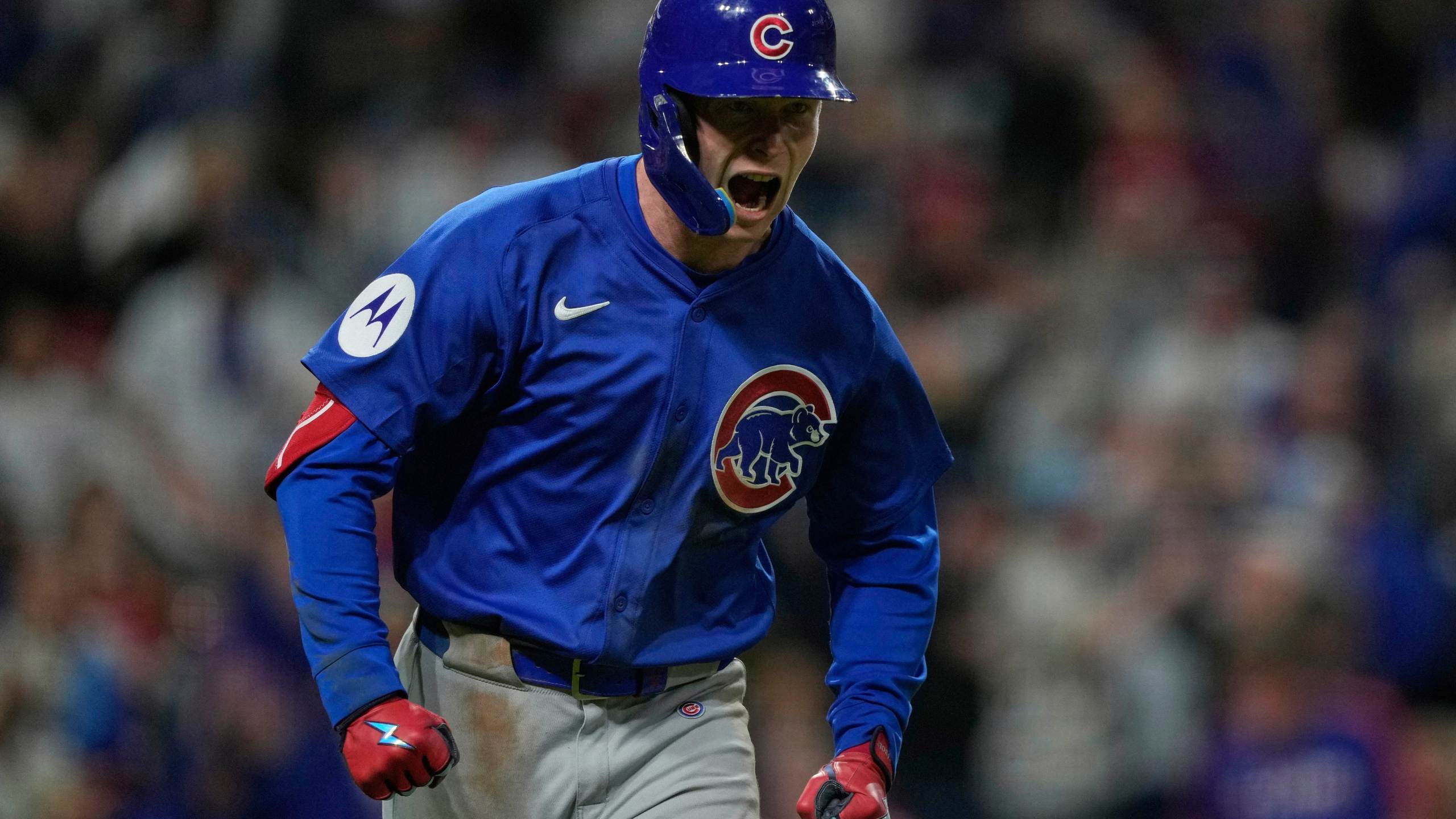 Chicago Cubs' Pete Crow-Armstrong reacts after hitting a grand slam to right field during the seventh inning of a baseball game against the Cincinnati Reds, Friday, May 23, 2025, in Cincinnati. (AP Photo/Carolyn Kaster)