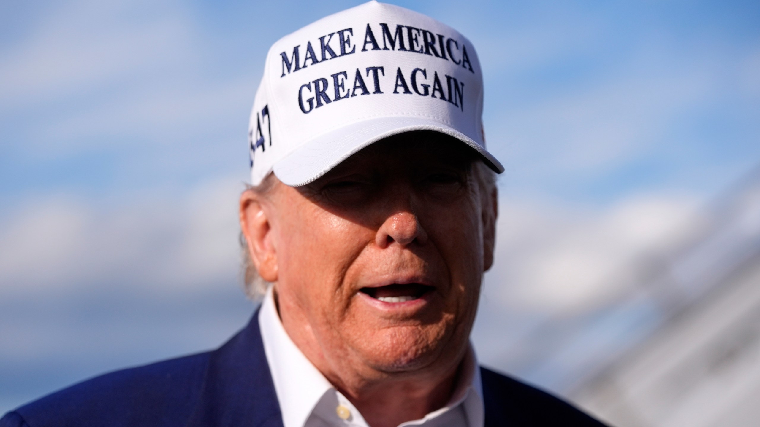 President Donald Trump speaks to reporters before boarding Air Force One at Morristown Municipal Airport in Morristown, N.J., Sunday, May 25, 2025. (AP Photo/Manuel Balce Ceneta)