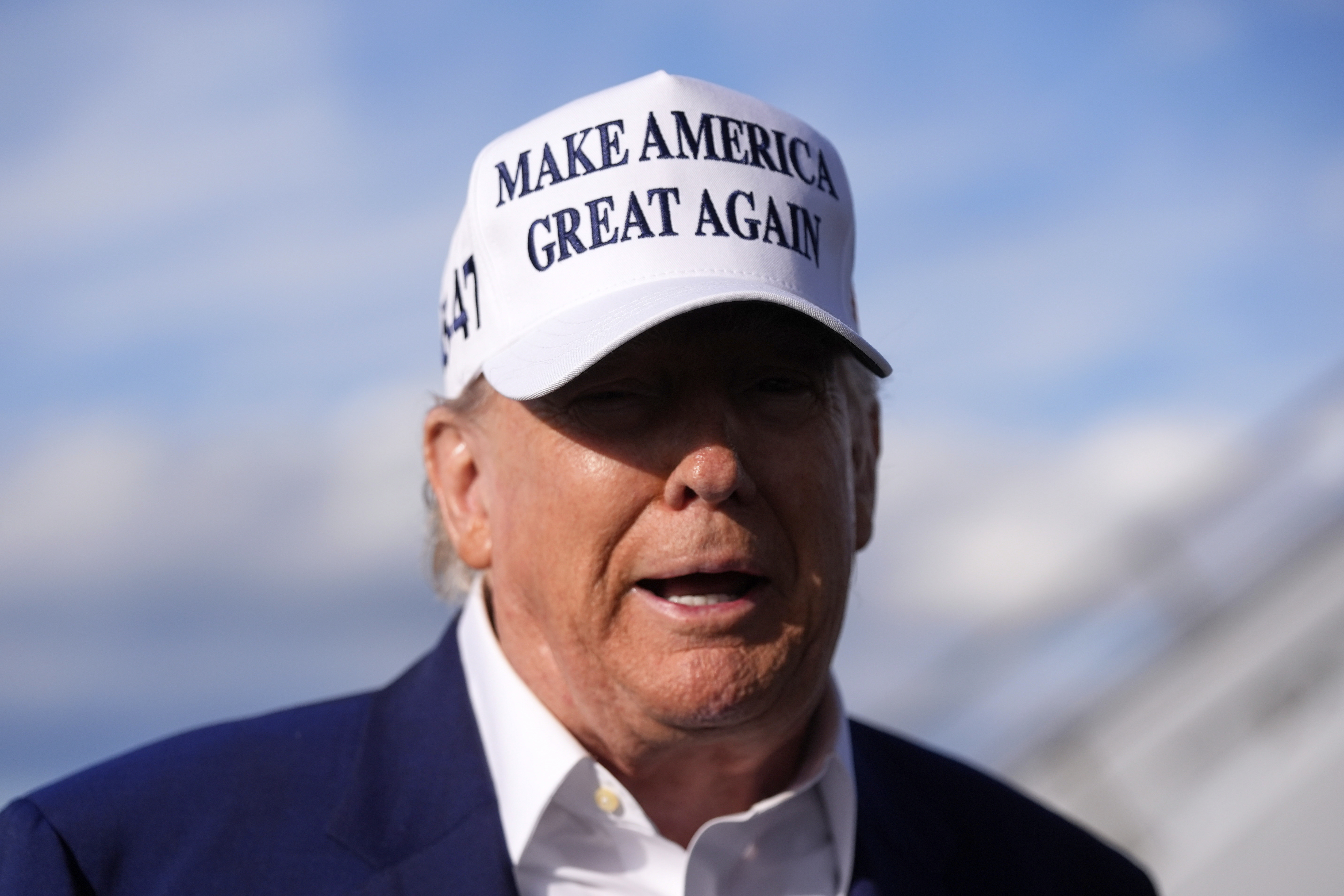 President Donald Trump speaks to reporters before boarding Air Force One at Morristown Municipal Airport in Morristown, N.J., Sunday, May 25, 2025. (AP Photo/Manuel Balce Ceneta)
