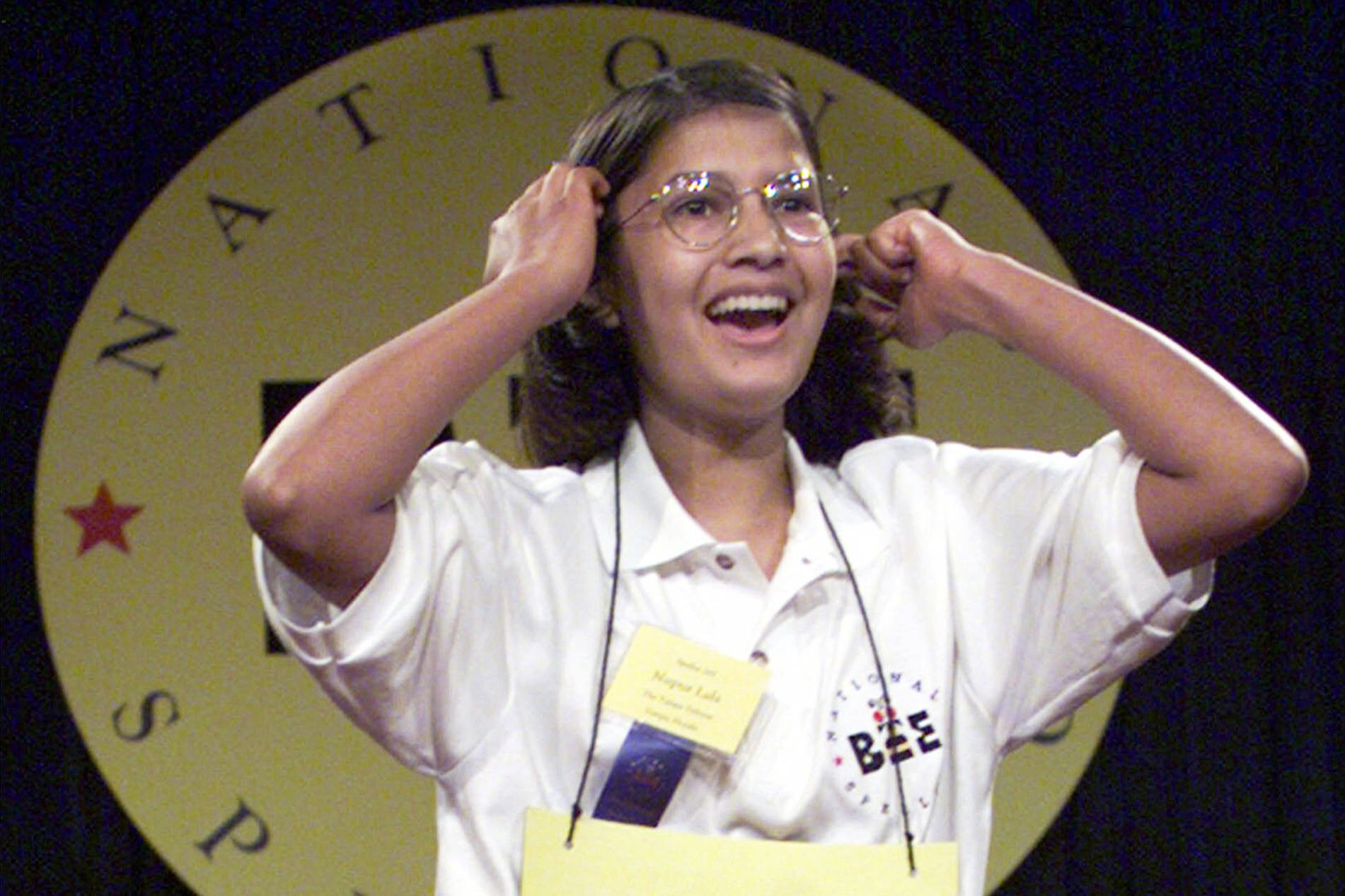 FILE – In this June 3, 1999 file photo Nupur Lala, 14, from Tampa, Fla. reacts upon winning the 72nd annual National Spelling Bee in Washington after correctly spelling "logorrhea." (AP Photo/Ron Edmonds, File)