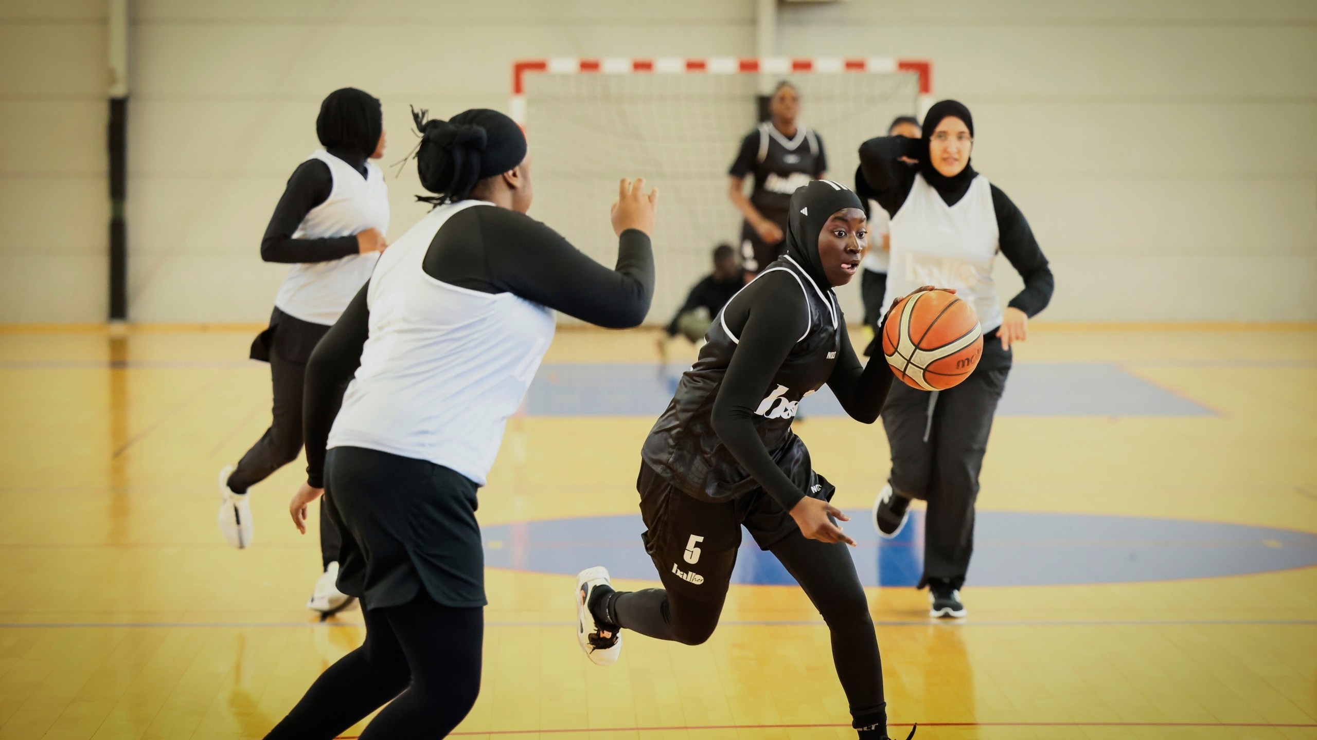 A player wearing a headscarf warms-up before a basketball game in Aubervilliers near Paris, Sunday, April 27, 2025. (AP Photo/Thomas Padilla)