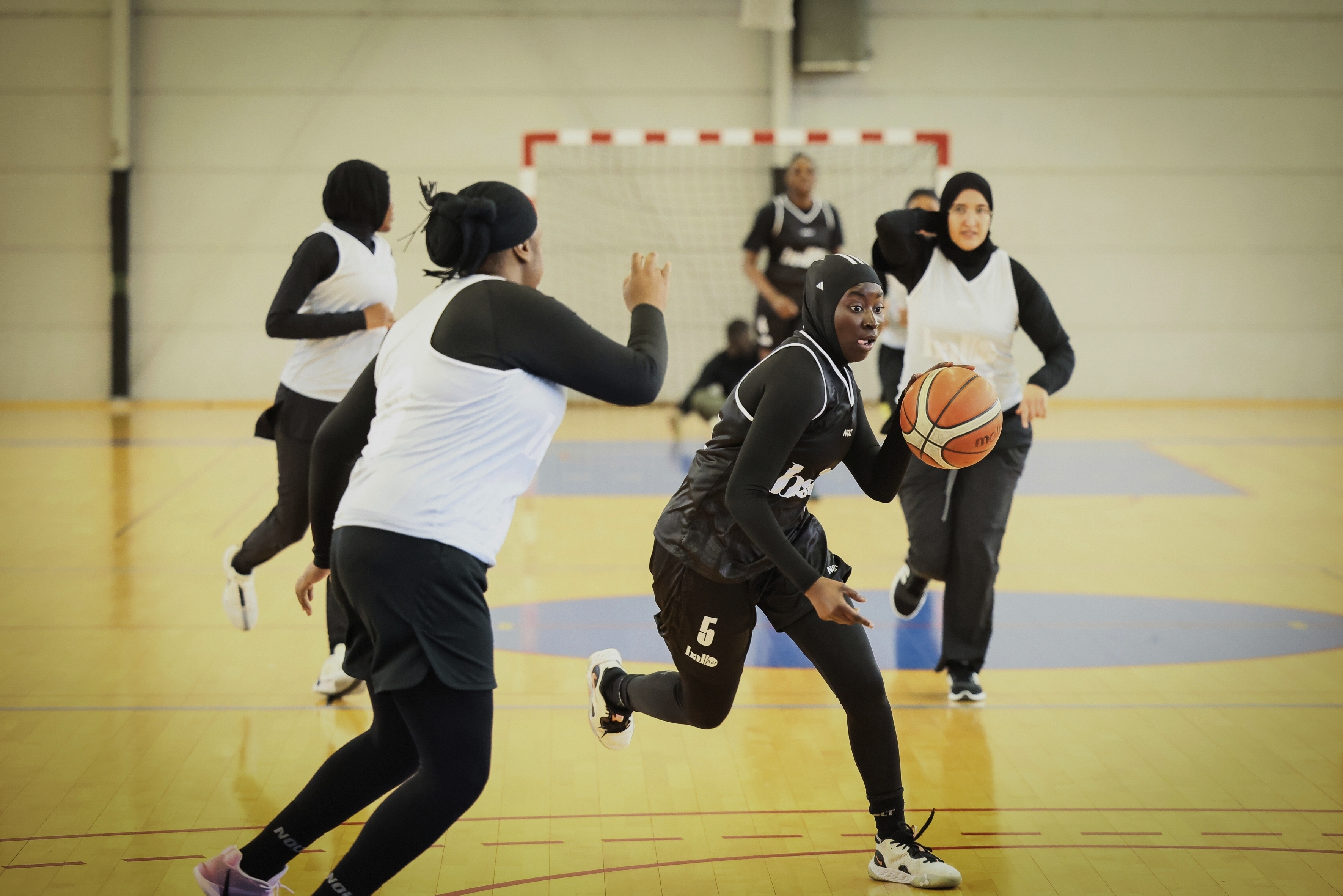 A player wearing a headscarf warms-up before a basketball game in Aubervilliers near Paris, Sunday, April 27, 2025. (AP Photo/Thomas Padilla)