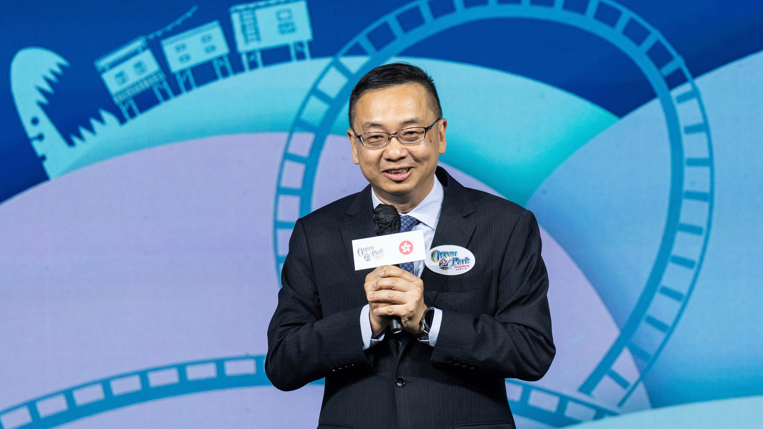 Benson Kwok, director of Immigration, speaks during the naming ceremony of the Hong Kong-born giant panda twin cubs Jia Jia and De De in Hong Kong, Tuesday, May 27, 2025. (AP Photo/Chan Long Hei)
