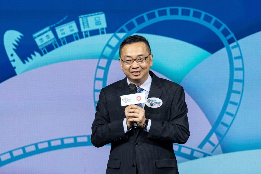 Benson Kwok, director of Immigration, speaks during the naming ceremony of the Hong Kong-born giant panda twin cubs Jia Jia and De De in Hong Kong, Tuesday, May 27, 2025. (AP Photo/Chan Long Hei)