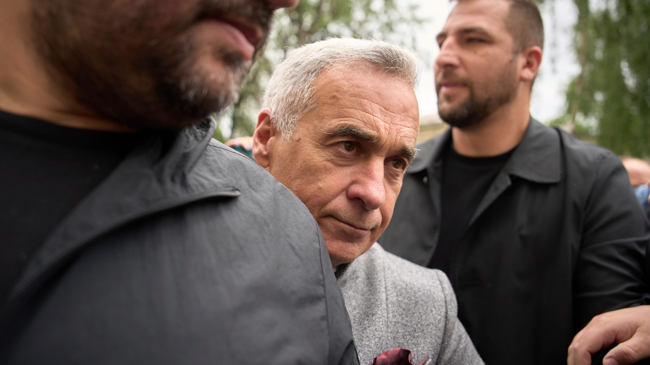 Calin Georgescu, the winner of the first round of last year's annulled election, arrives at a prosecutor's office in Bucharest, Romania, Tuesday, May 27, 2025. (AP Photo/Vadim Ghirda)