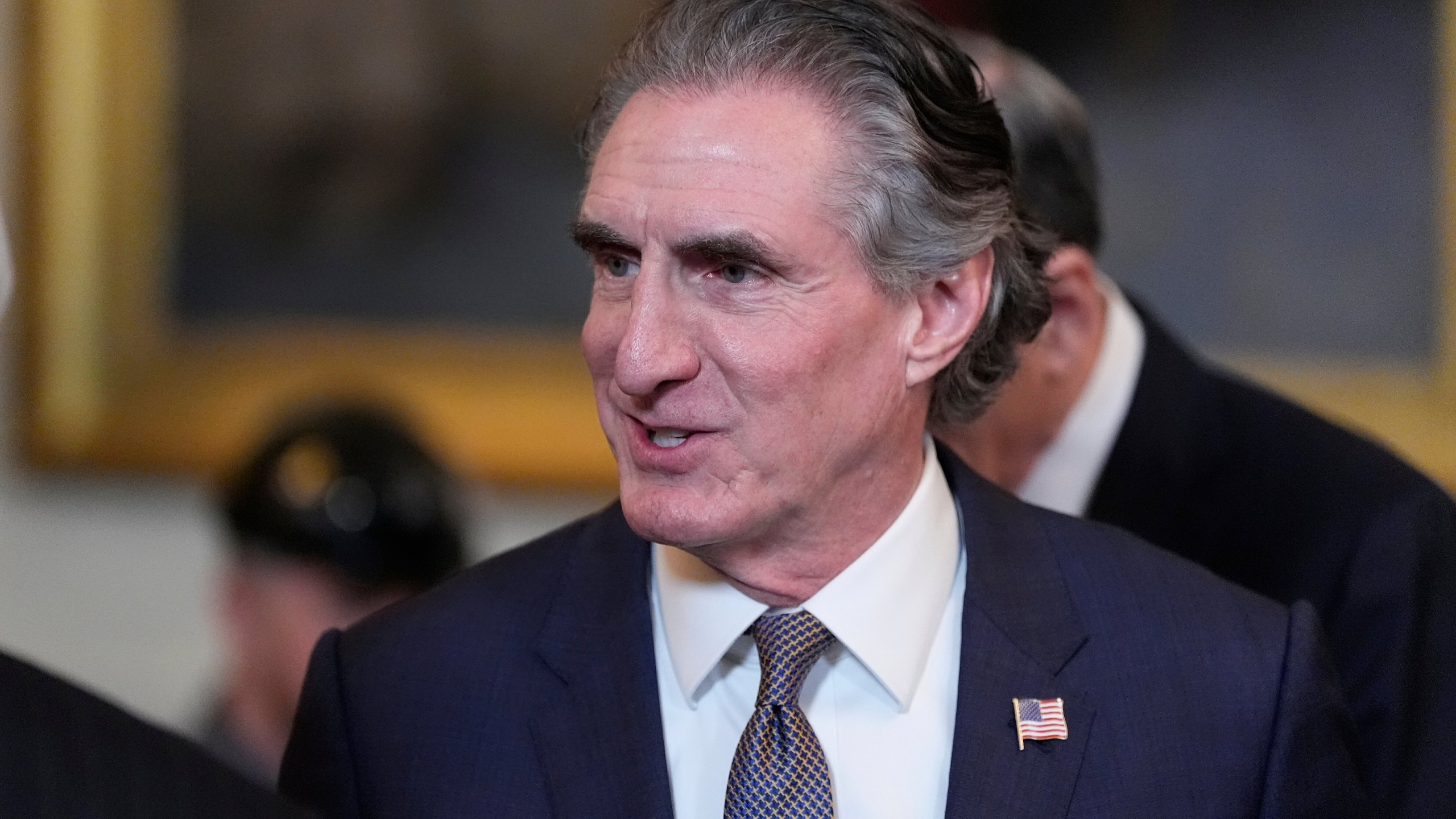 FILE - Interior Secretary Doug Burgum arrives before President Donald Trump speaks during an executive order signing event in the East Room of the White House, Tuesday, April 8, 2025, in Washington. (AP Photo/Alex Brandon,File)