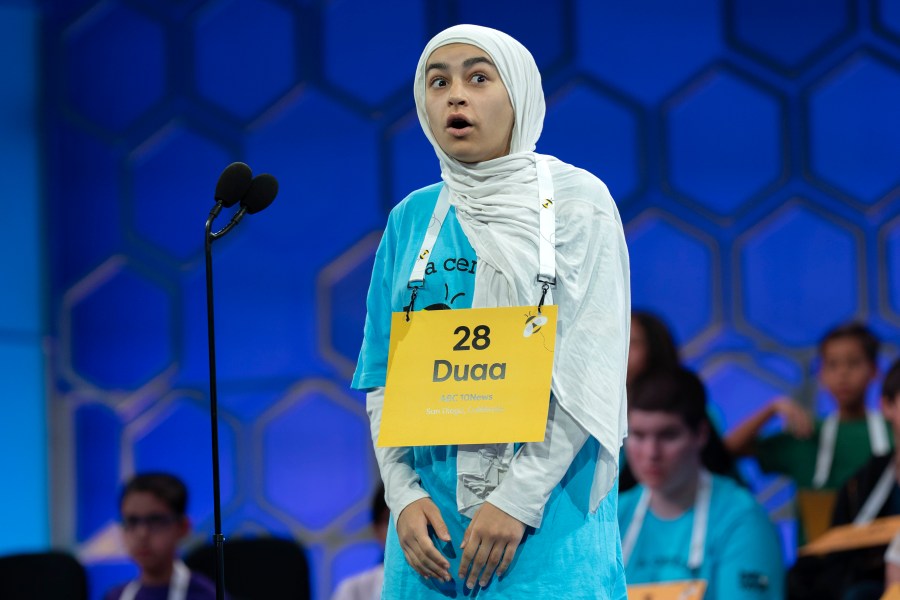 Duaa Siyah Ouznali, 13, of San Diego, reacts after correctly spelling her word as she competes during the first preliminary round of the Scripps National Spelling Bee at the Gaylord National Resort & Convention Center, Tuesday, May 27, 2025, in Oxon Hill, Md. (AP Photo/Jose Luis Magana)