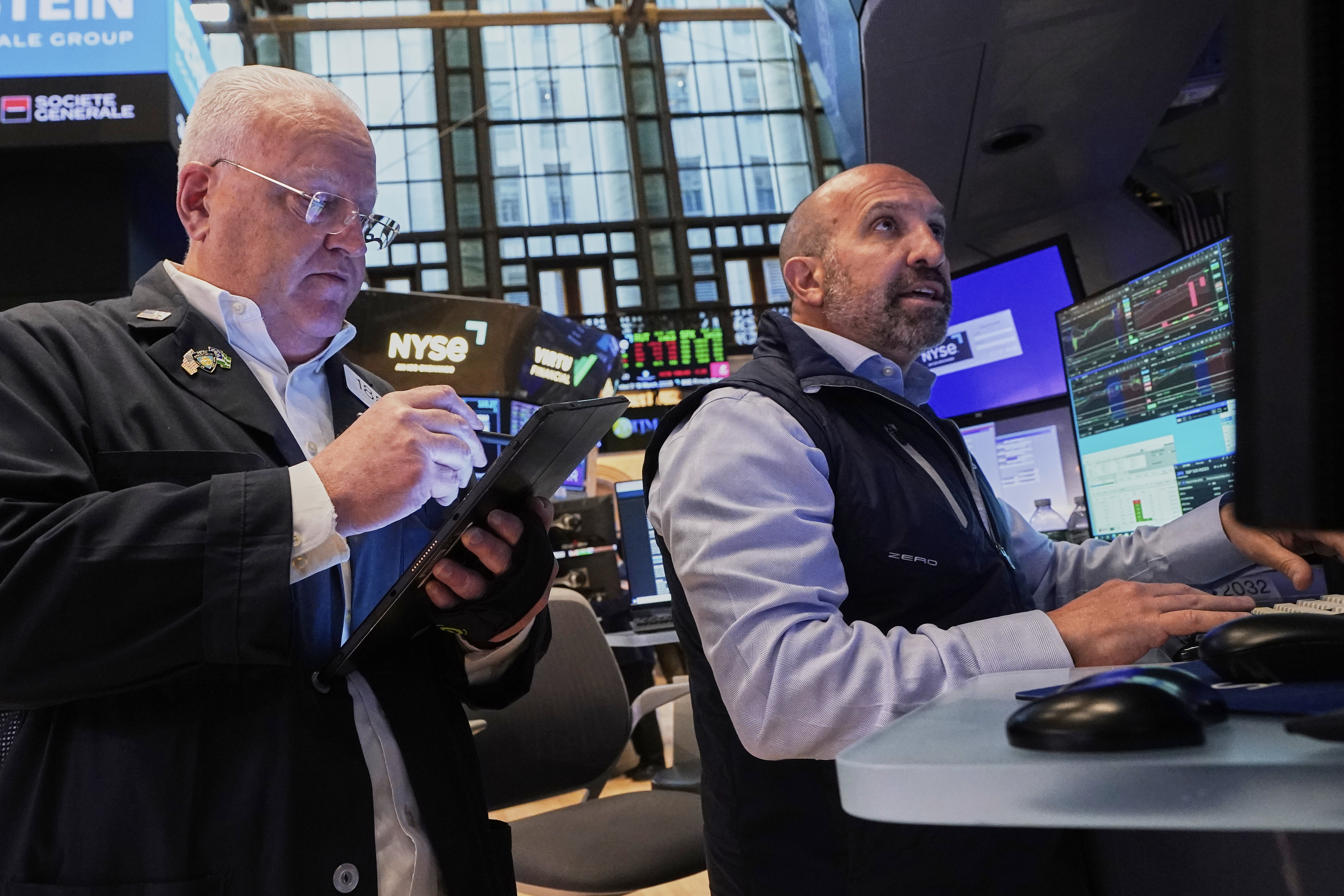 Trader Thomas Ferrigno, left, and specialist James Denaro work on the floor of the New York Stock Exchange, Tuesday, May 27, 2025. (AP Photo/Richard Drew)