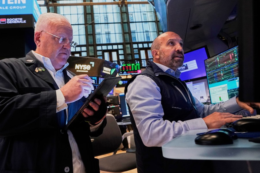 Trader Thomas Ferrigno, left, and specialist James Denaro work on the floor of the New York Stock Exchange, Tuesday, May 27, 2025. (AP Photo/Richard Drew)