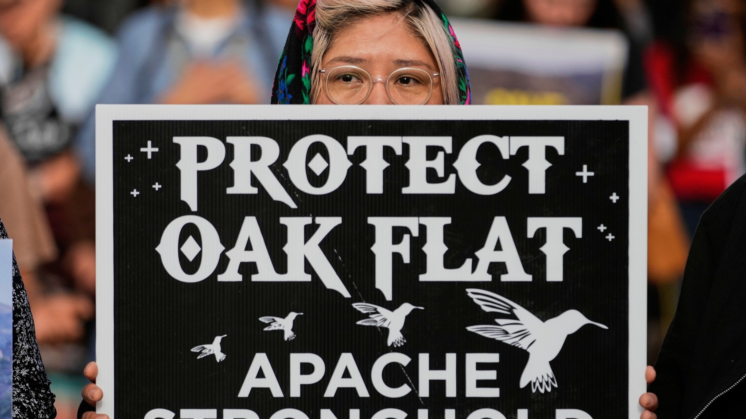 FILE - Members of Apache and others who want to halt a massive copper mining project on federal land in Arizona gather outside the U.S. District Court, May 7, 2025, in Phoenix. (AP Photo/Matt York, File)