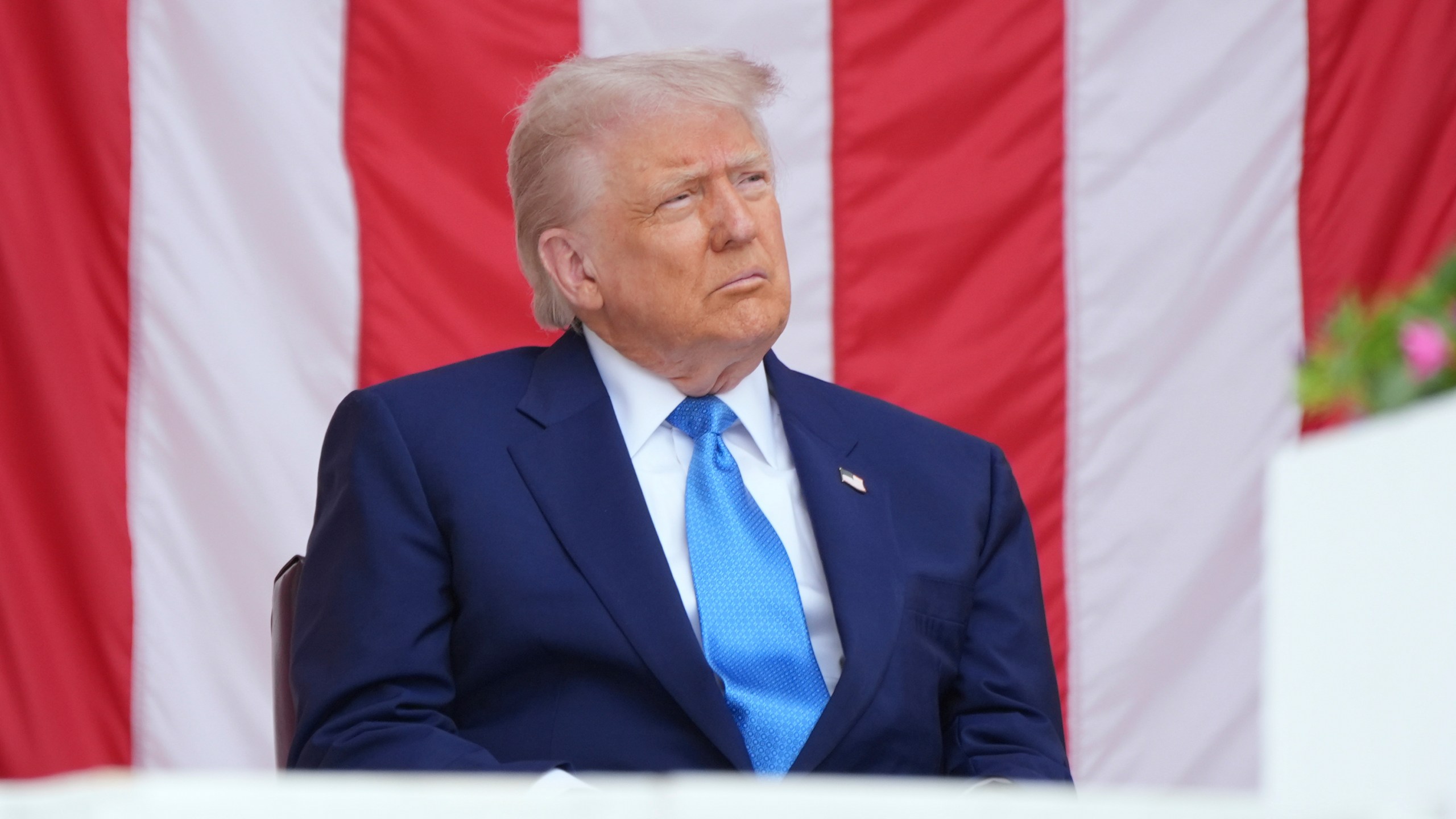 President Donald Trump listens during the 157th National Memorial Day Observance at Arlington National Cemetery, Monday, May 26, 2025, in Arlington, Va. (AP Photo/Jacquelyn Martin)
