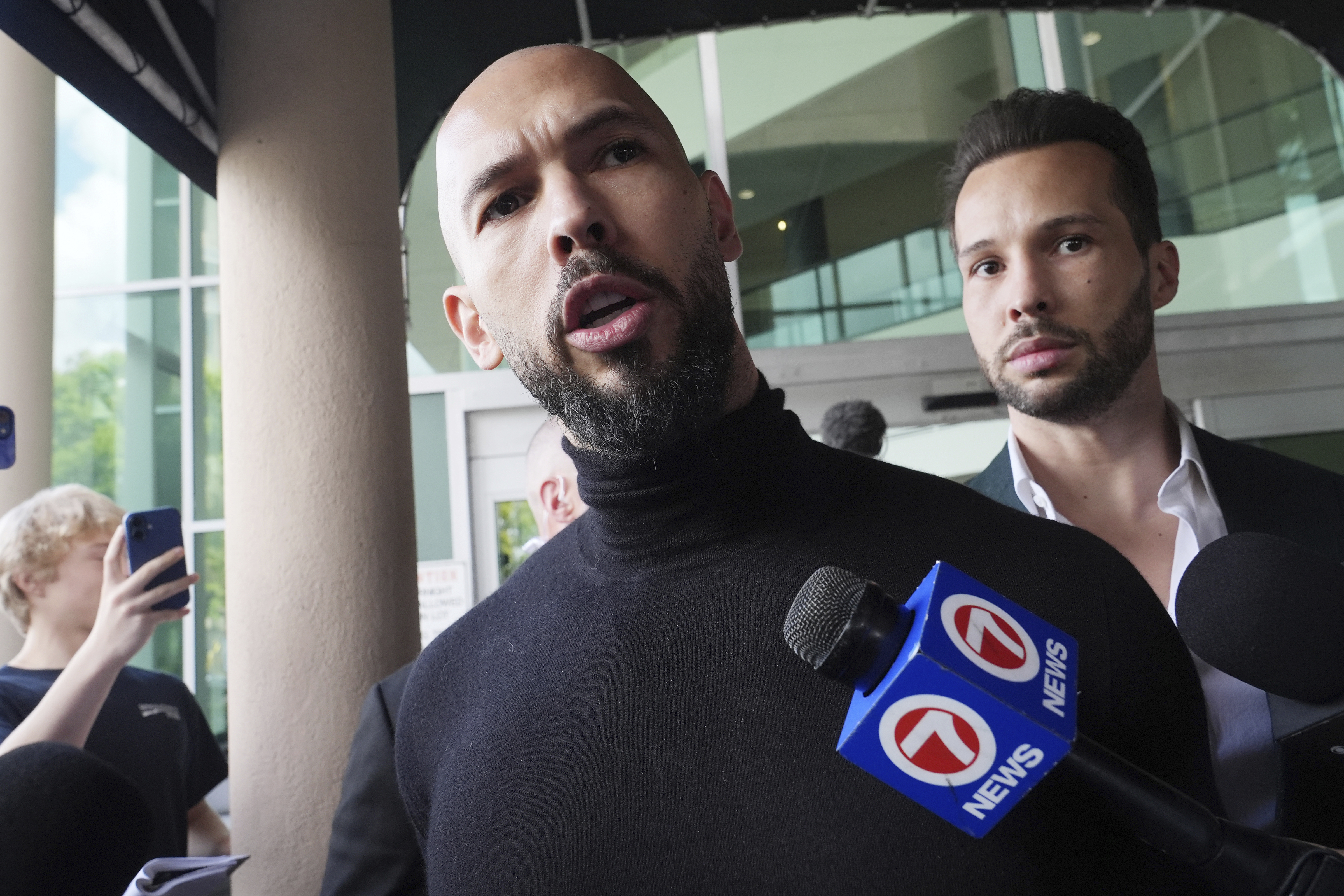 FILE - Influencer brothers Andrew and Tristan Tate arrive, Thursday, Feb. 27, 2025, in Fort Lauderdale, Fla. (AP Photo/Marta Lavandier, File)