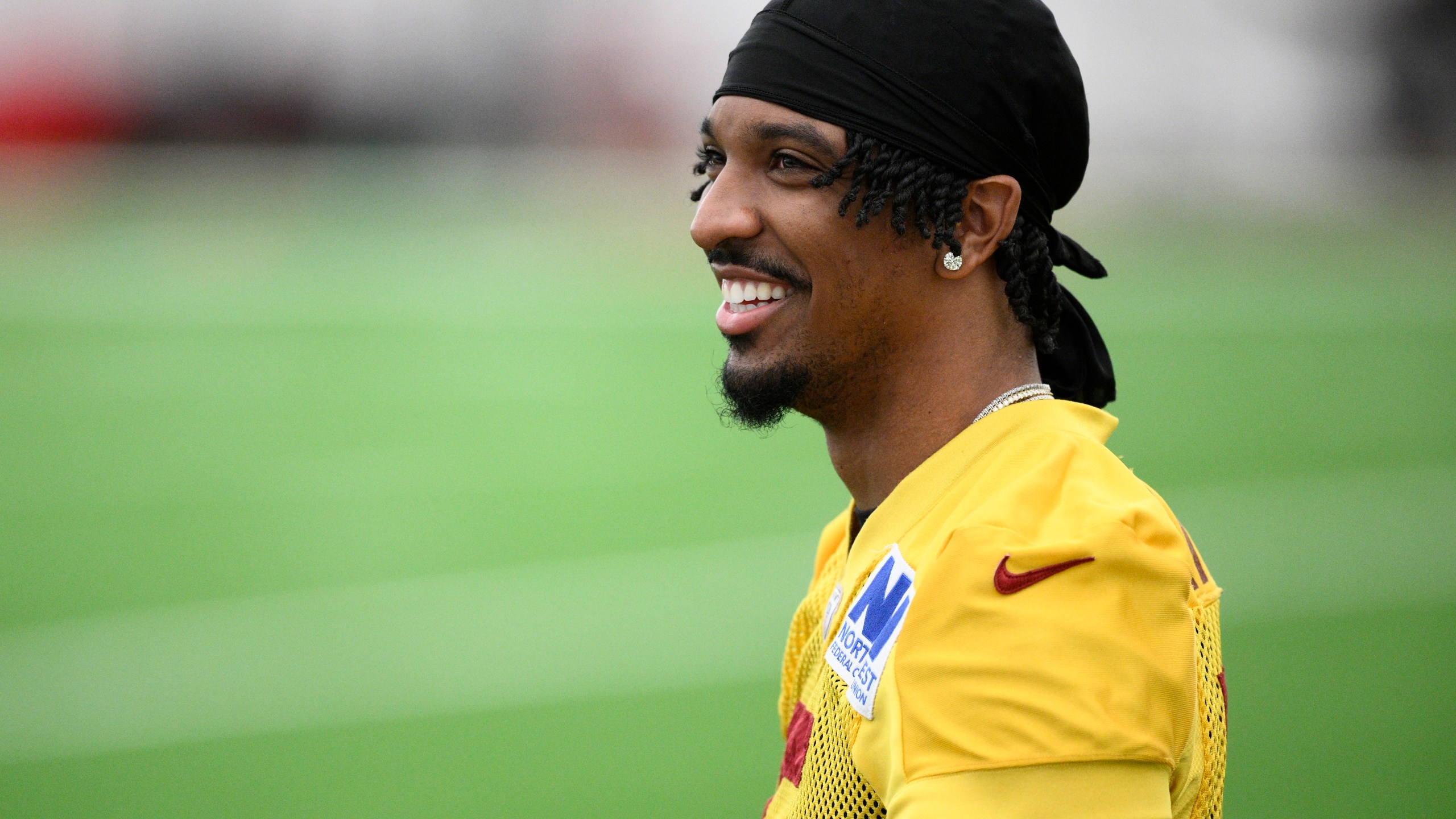 Washington Commanders quarterback Jayden Daniels looks on during an NFL football practice, Wednesday, May 28, 2025, in Ashburn, Va. (AP Photo/Nick Wass)