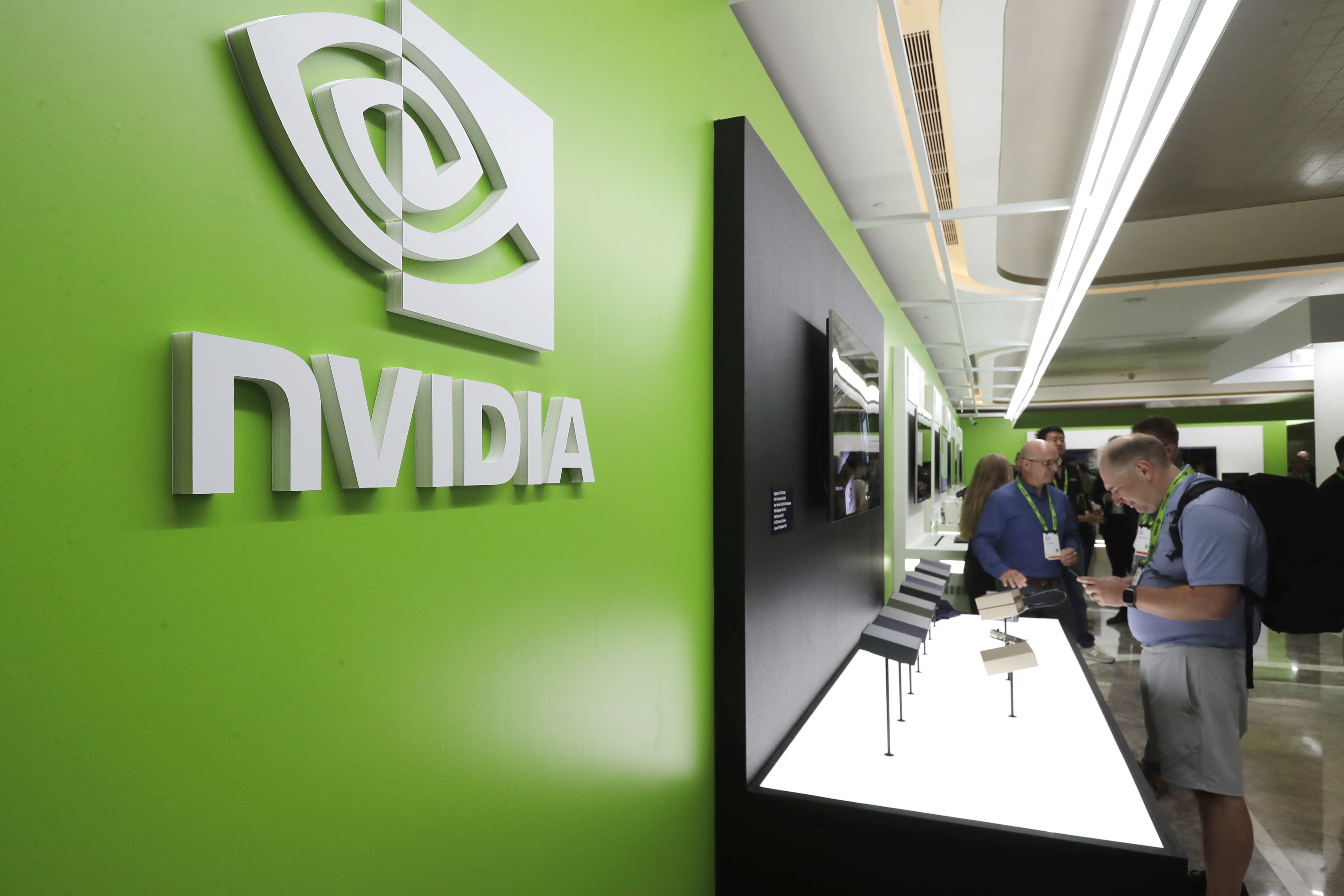FILE - People take a look to Nvidia''s new products during the Computex 2025 exhibition in Taipei, Taiwan, Wednesday, May 21, 2025. (AP Photo/Chiang Ying-ying, File)