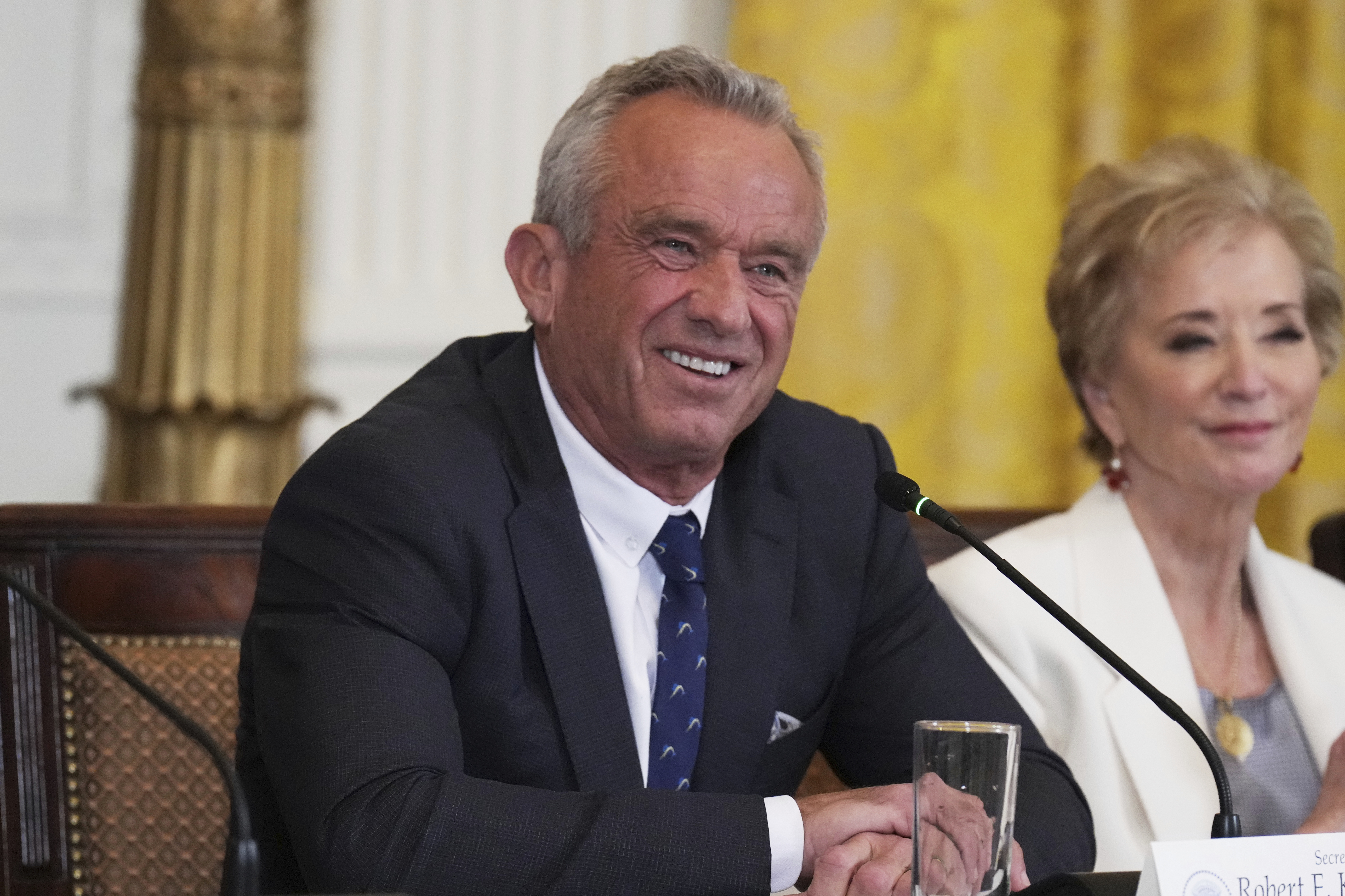 Health and Human Services Secretary Robert F. Kennedy Jr., left, and Education Secretary Linda McMahon attend a Make America Healthy Again (MAHA) Commission Event in the East Room of the White House, Thursday, May 22, 2025, in Washington. (AP Photo/Jacquelyn Martin)