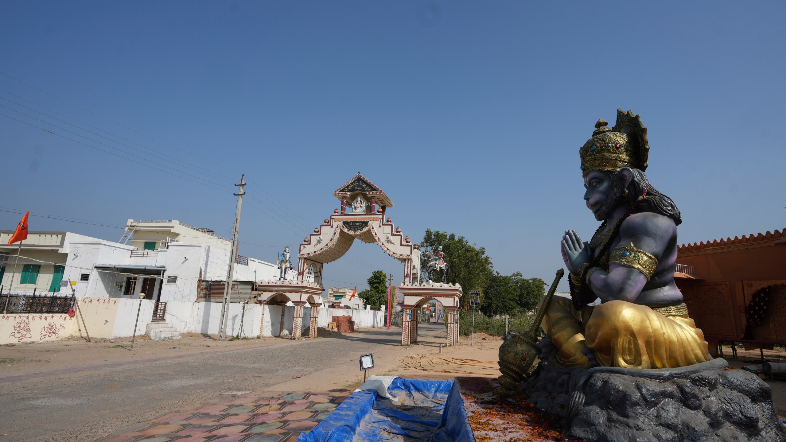 FILE - A statue of Monkey God Hanuman, installed as part of a religious celebrations, is seen in front of an entrance gate of Dingucha village in Gandhinagar, India, Tuesday, Nov. 12, 2024. (AP Photo/Ajit Solanki, File)
