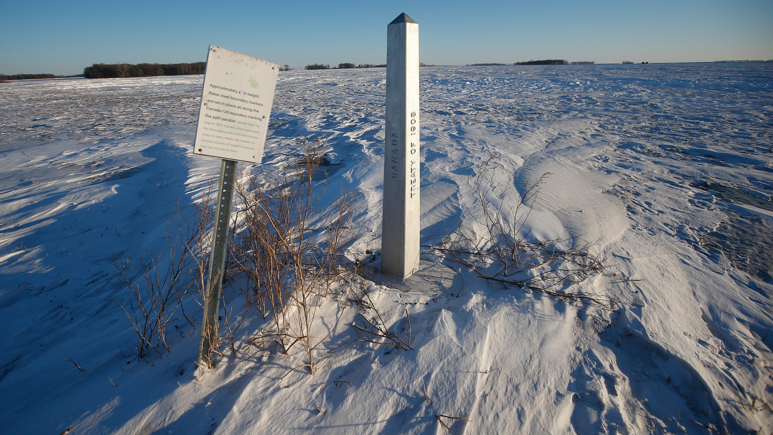 FILE - A border marker, between the United States and Canada is shown just outside of Emerson, Manitoba, on Thursday, Jan. 20, 2022. (John Woods/The Canadian Press via AP, File)
