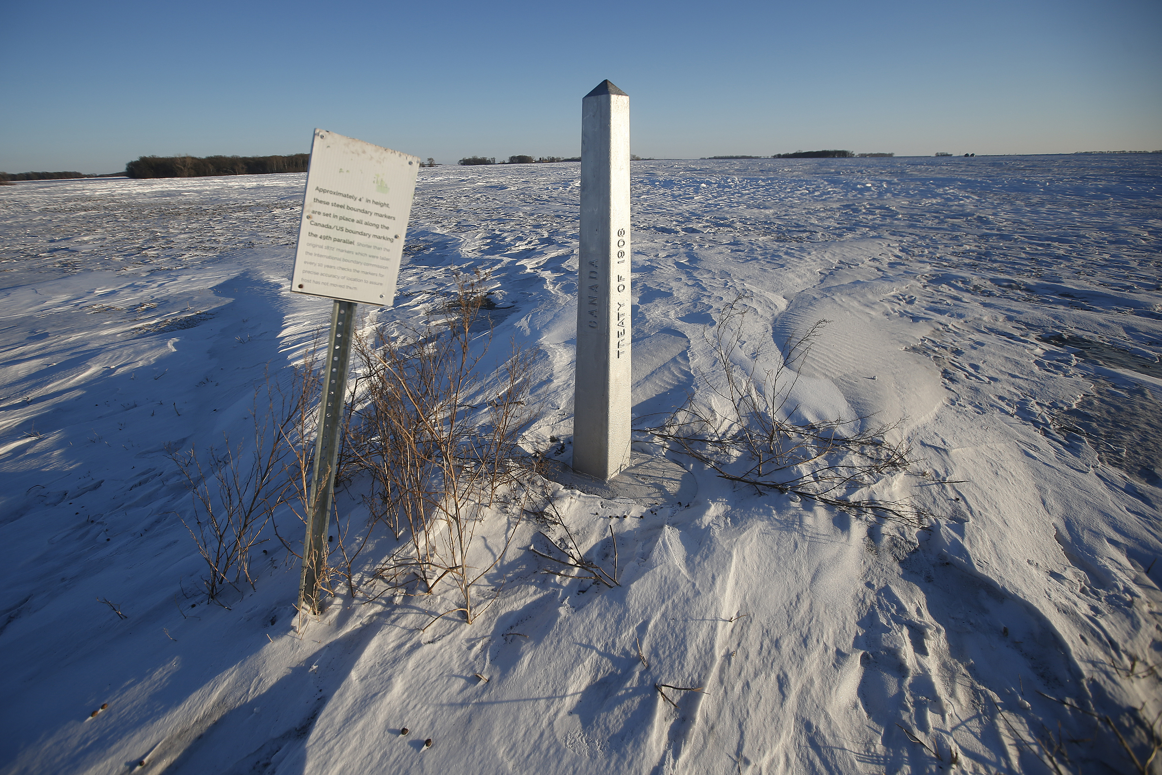 FILE - A border marker, between the United States and Canada is shown just outside of Emerson, Manitoba, on Thursday, Jan. 20, 2022. (John Woods/The Canadian Press via AP, File)