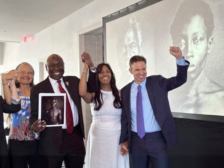 Susanna Moore, left, the great-great-great-granddaughter of Harvard biologist Louis Agassiz, celebrates with Tamara Lanier, second right, and attorneys Ben Crump and Josh Koskoff at the Boston Marriott Long Wharf hotel on Wednesday, March 28, 2025 in Boston, Mass. (AP Photo/Leah Willingham)
