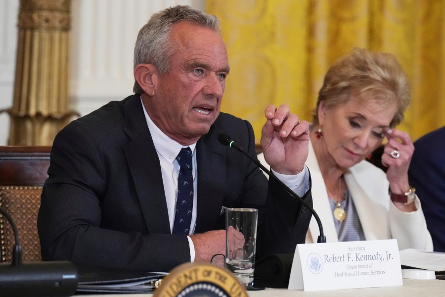 Health and Human Services Secretary Robert F. Kennedy Jr. speaks as Education Secretary Linda McMahon listens during a Make America Healthy Again (MAHA) Commission Event in the East Room of the White House, Thursday, May 22, 2025, in Washington. (AP Photo/Jacquelyn Martin)