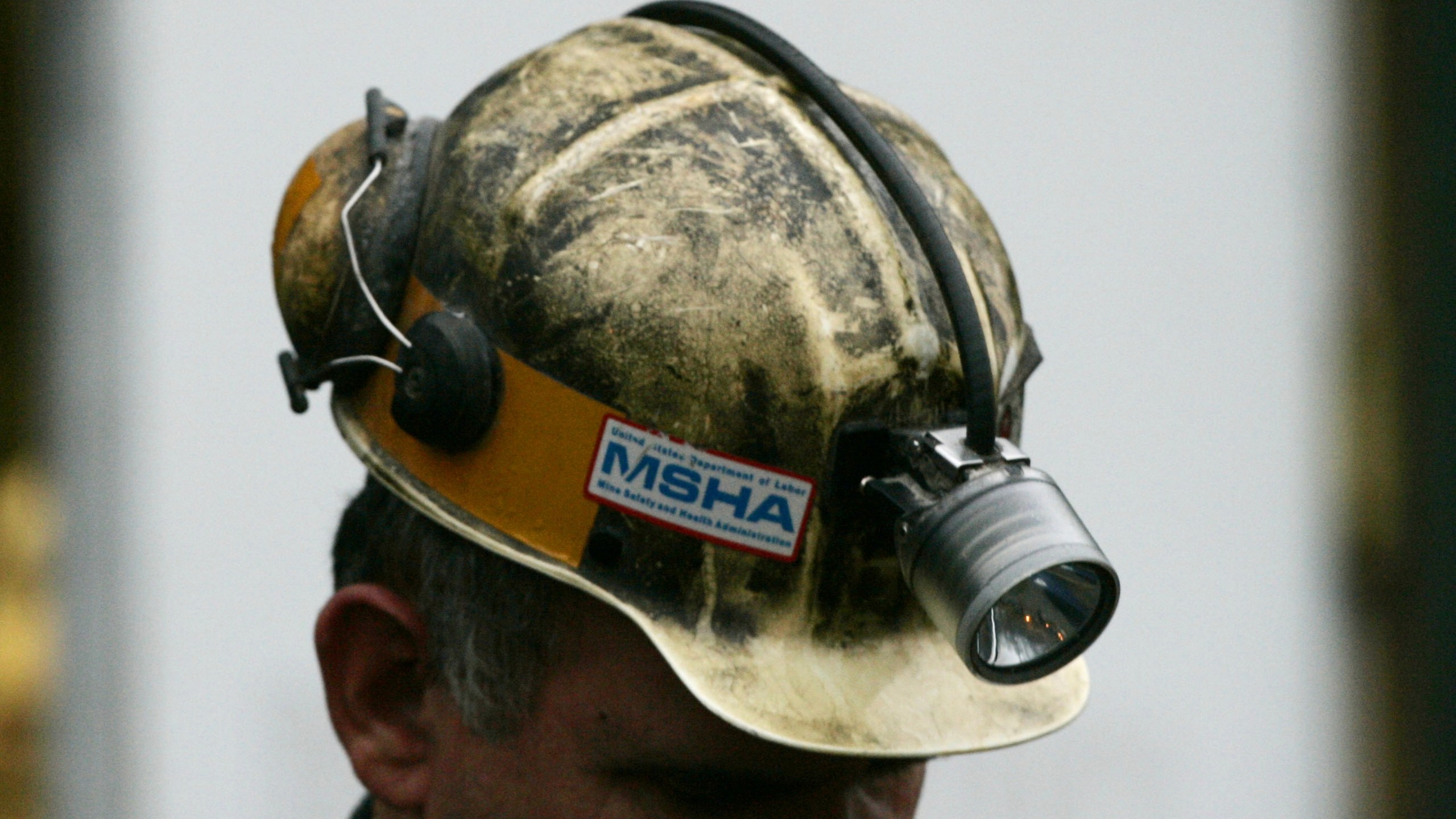 FILE - A miner gathers his thought before taking part in a rescue mission, Tuesday, Jan. 3, 2006, in Tallmansville, W.Va.. (AP Photo/Haraz N. Ghanbari, Pool, File)