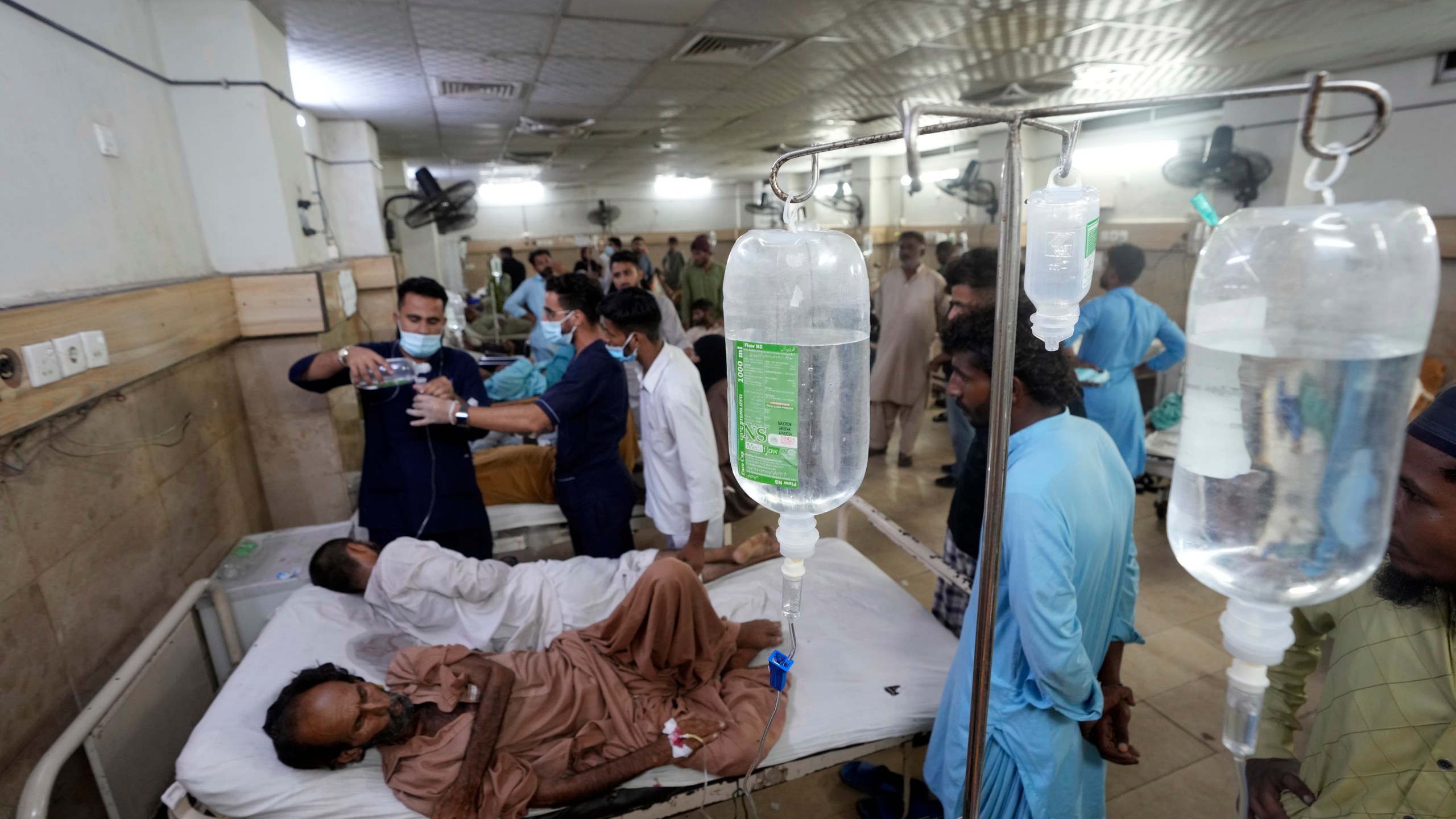 FILE - Heatstroke patients receive treatment at a hospital in Karachi, Pakistan, Thursday, July 25, 2024. (AP Photo/Fareed Khan,File)